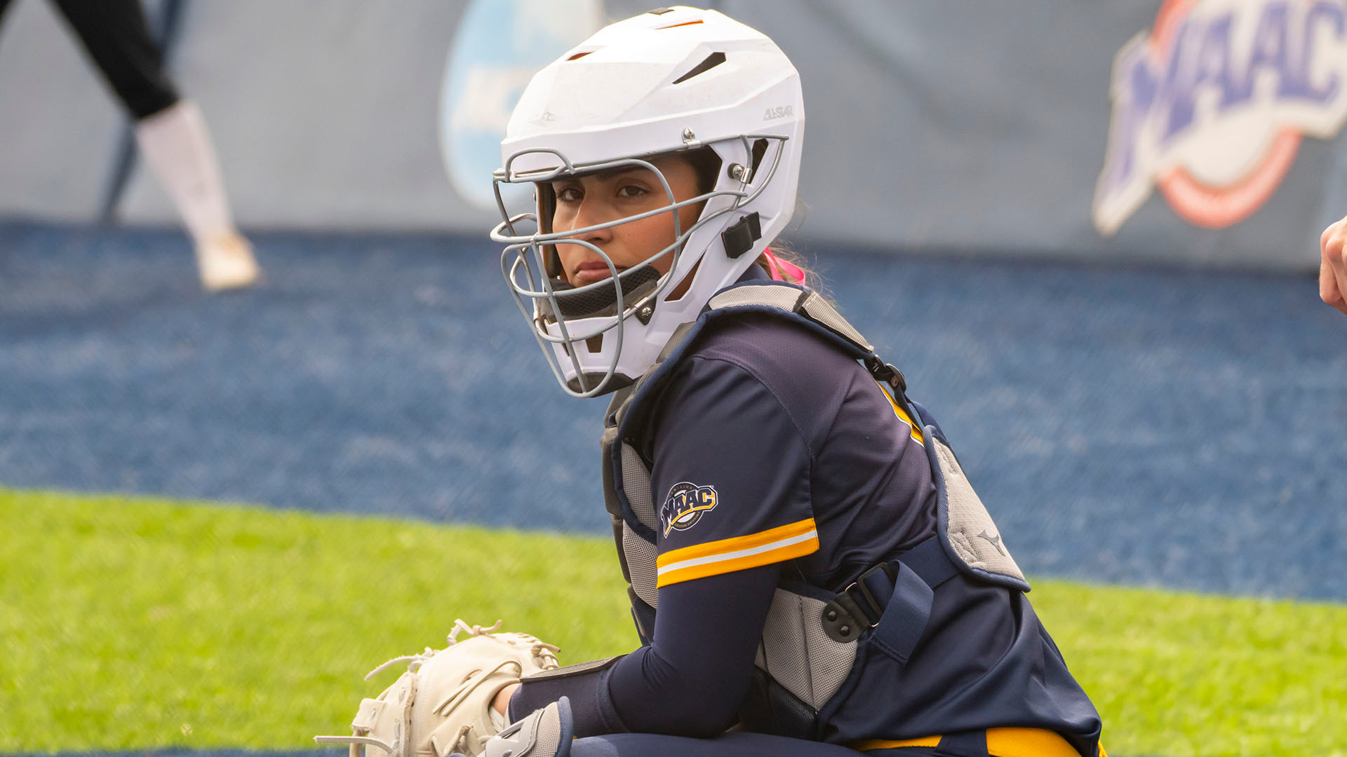 Talia Yermian looks into the dugout for a pitch call in a home game against Fairfield on March 29, 2026.