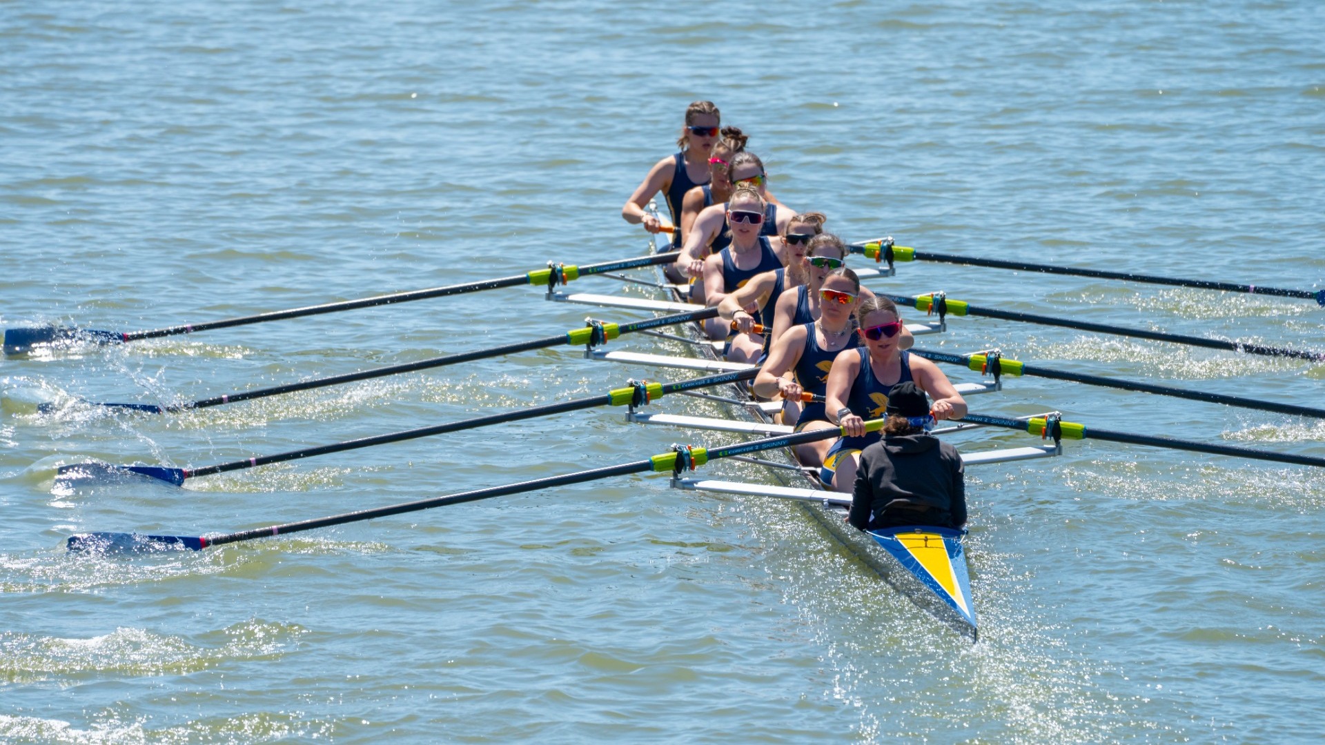 Varsity 8+ boat rows down niagara river at the Black Rock Cup on April 27th 2025.