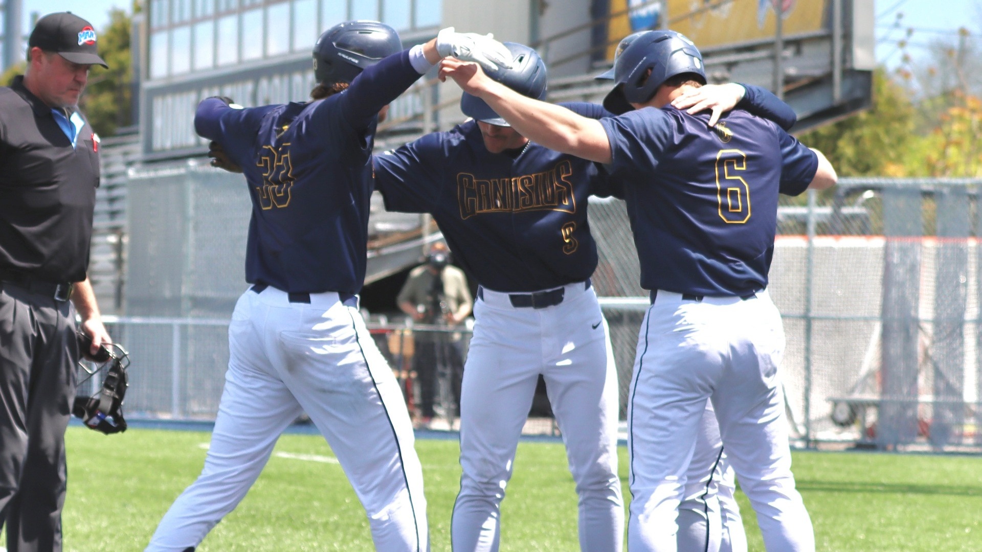 Thomas Zwirecki, Bennett Cox, and Owen Silliman celebrate at home plate vs. Siena - May 15, 2026