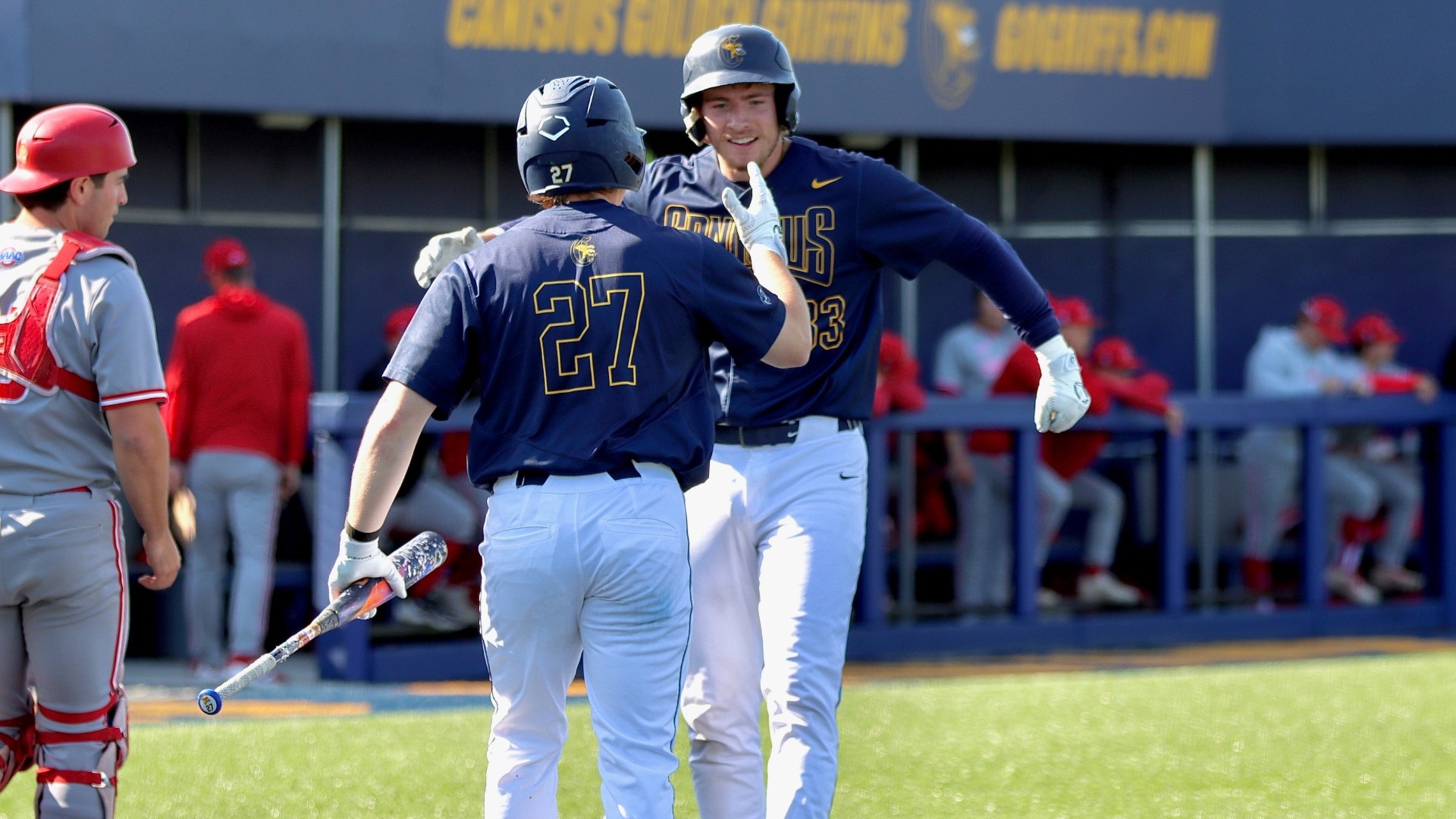 Thomas Zwirecki and Blake Herman celebrate at home plate in a conference game vs. Sacred Heart - May 8, 2026