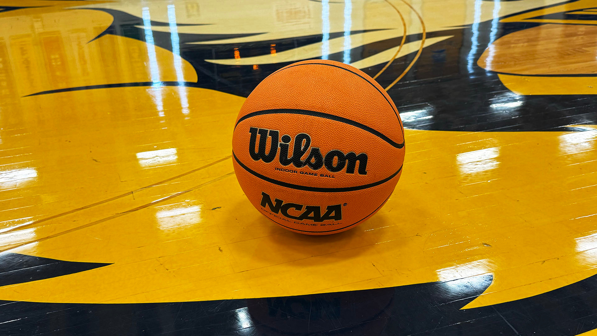 A generic photo of a college men's basketball on the floor of the Koessler Athletic Center