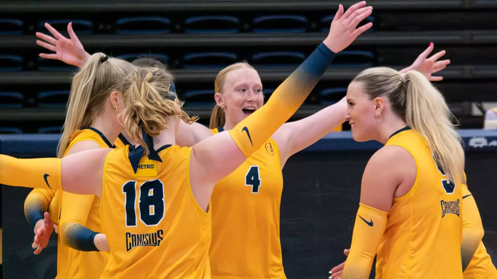 Members of the Canisius volleyball team celebrate a point in a home exhibition match against Daemen on Aug. 19, 2026.