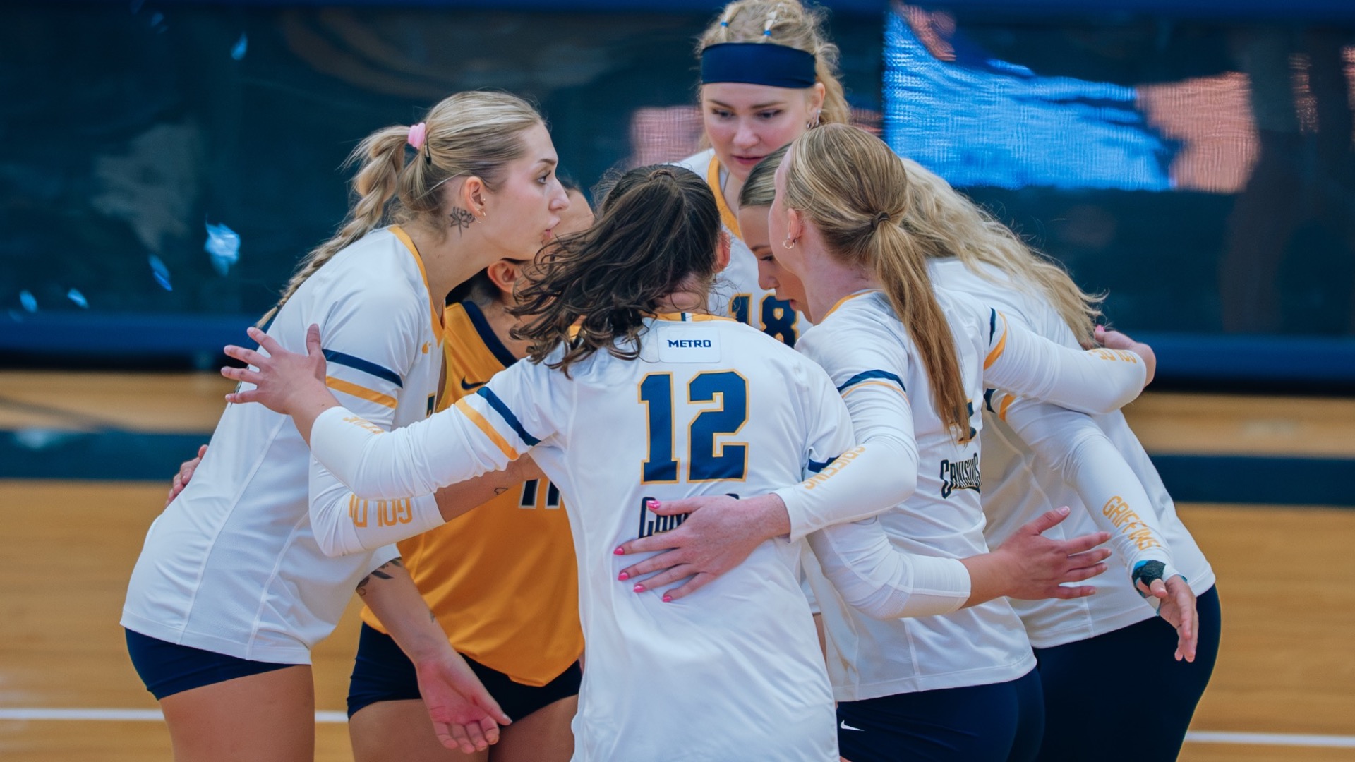 The Canisius Volleyball team huddles after a point against UMBC