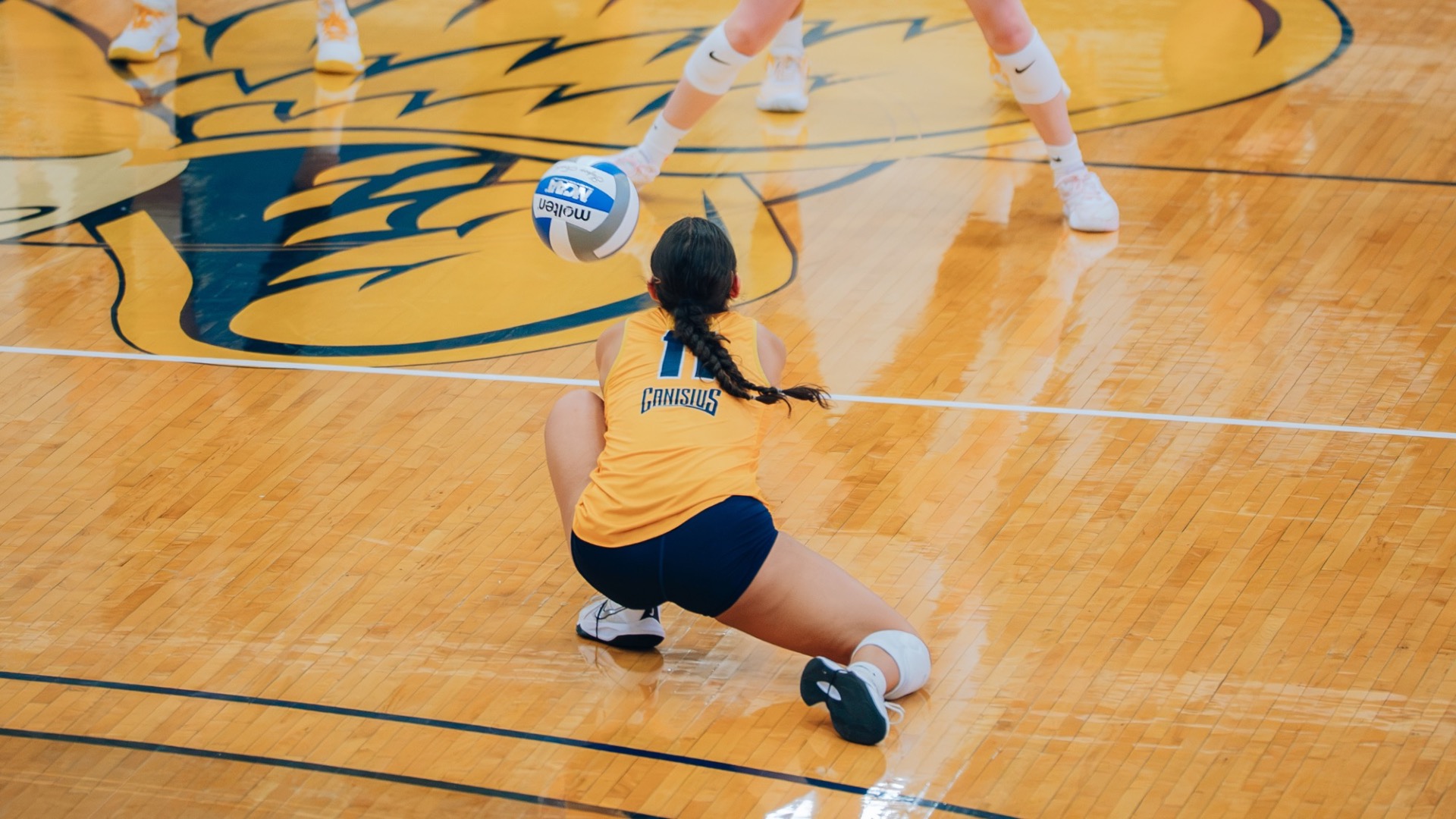 Brenda Reynaga receives a serve from UMBC