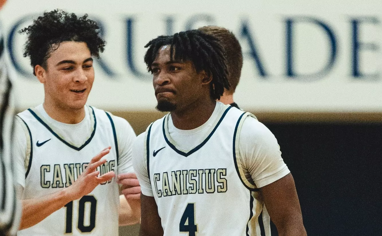 Nick Purdie (left) and Jahyden Clark after a made basket. 