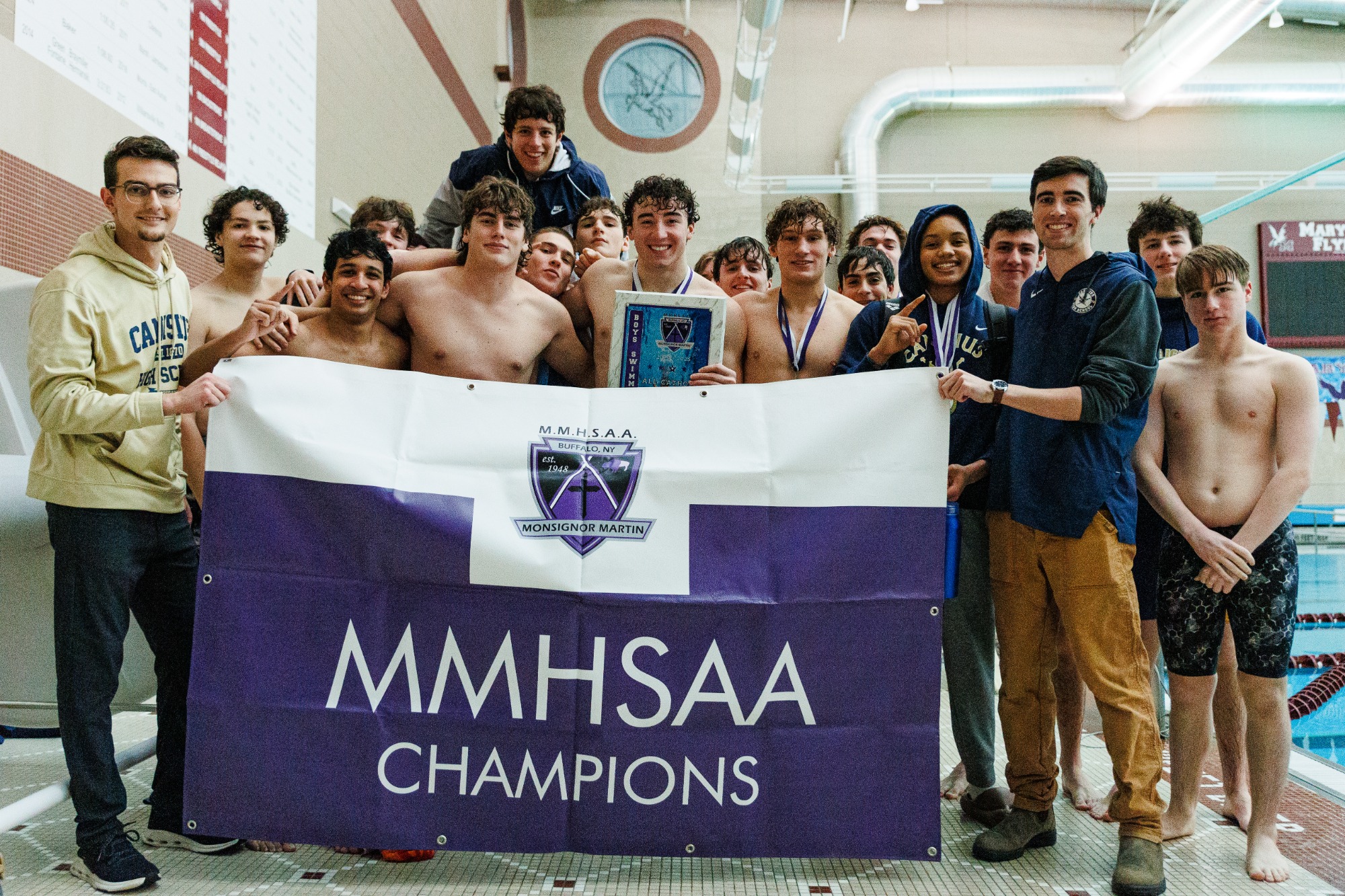 Team photo of 2025 champion Crusader swimming team. 