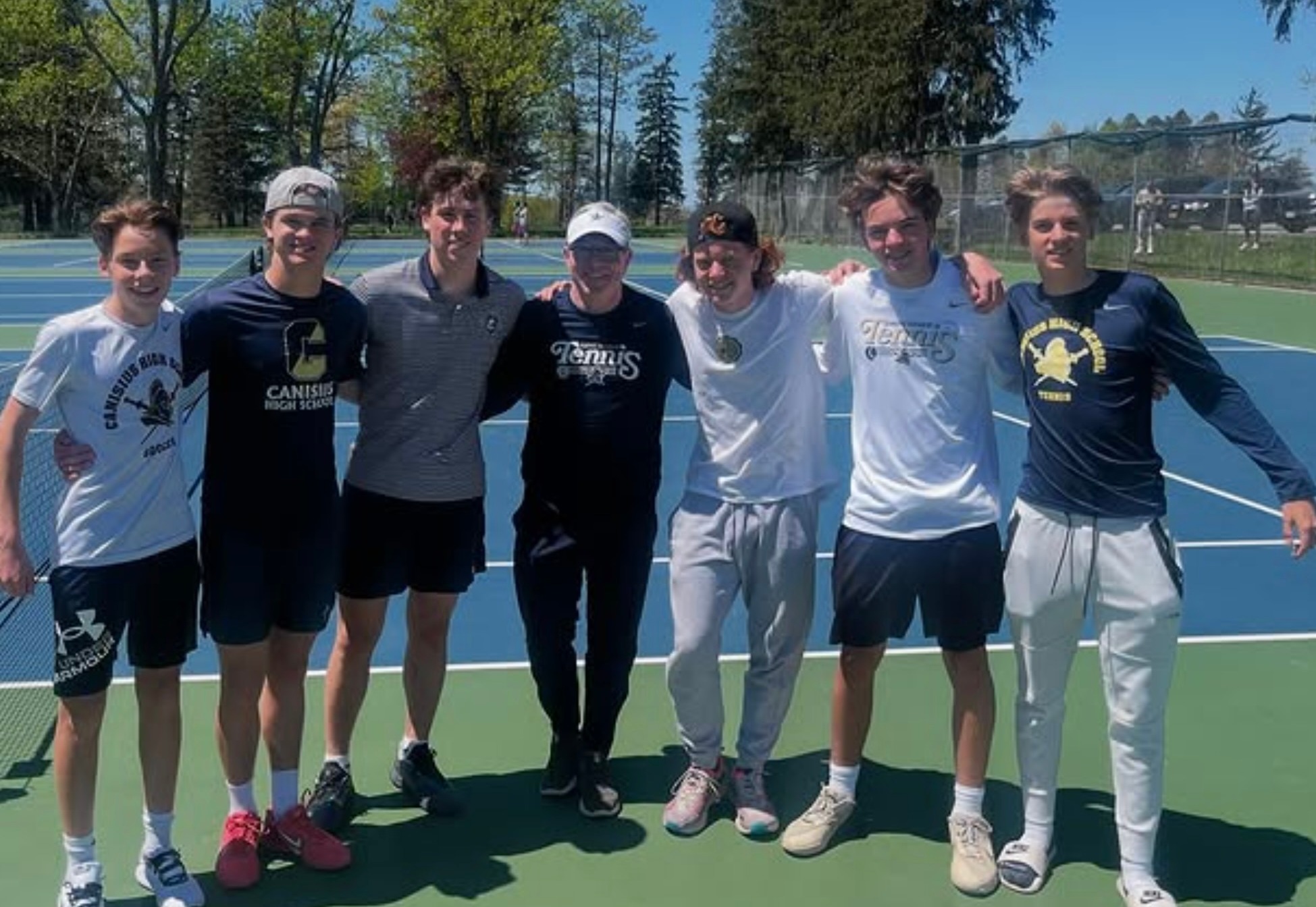 Canisius team on court following All-Catholic championships. 