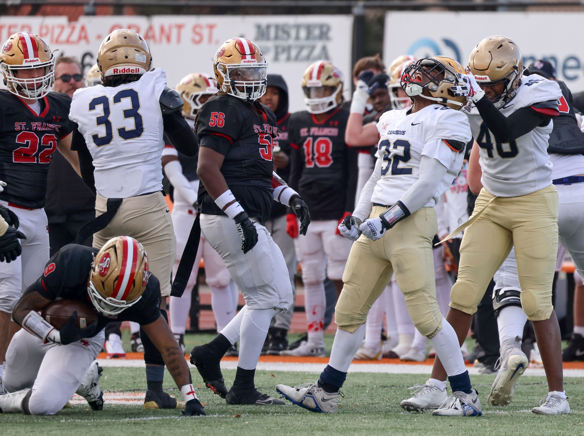 Canisius defense celebrates during MMAA final vs. St. Francis in 2025.