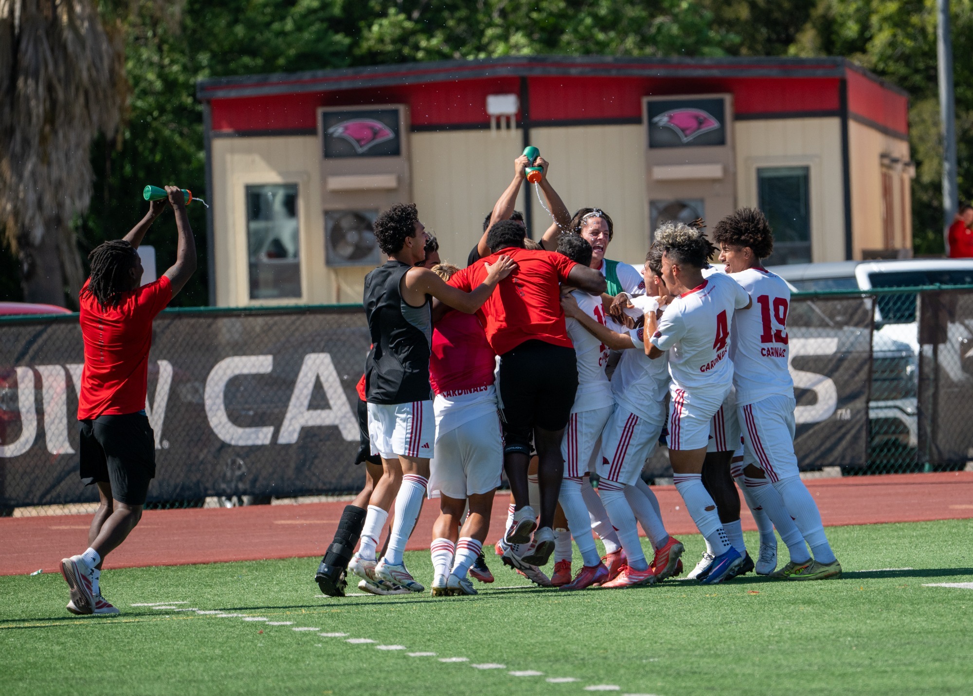 Men's soccer celebrates after penalty