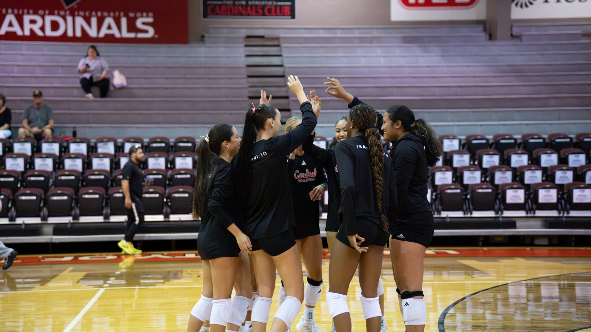 Volleyball team huddles