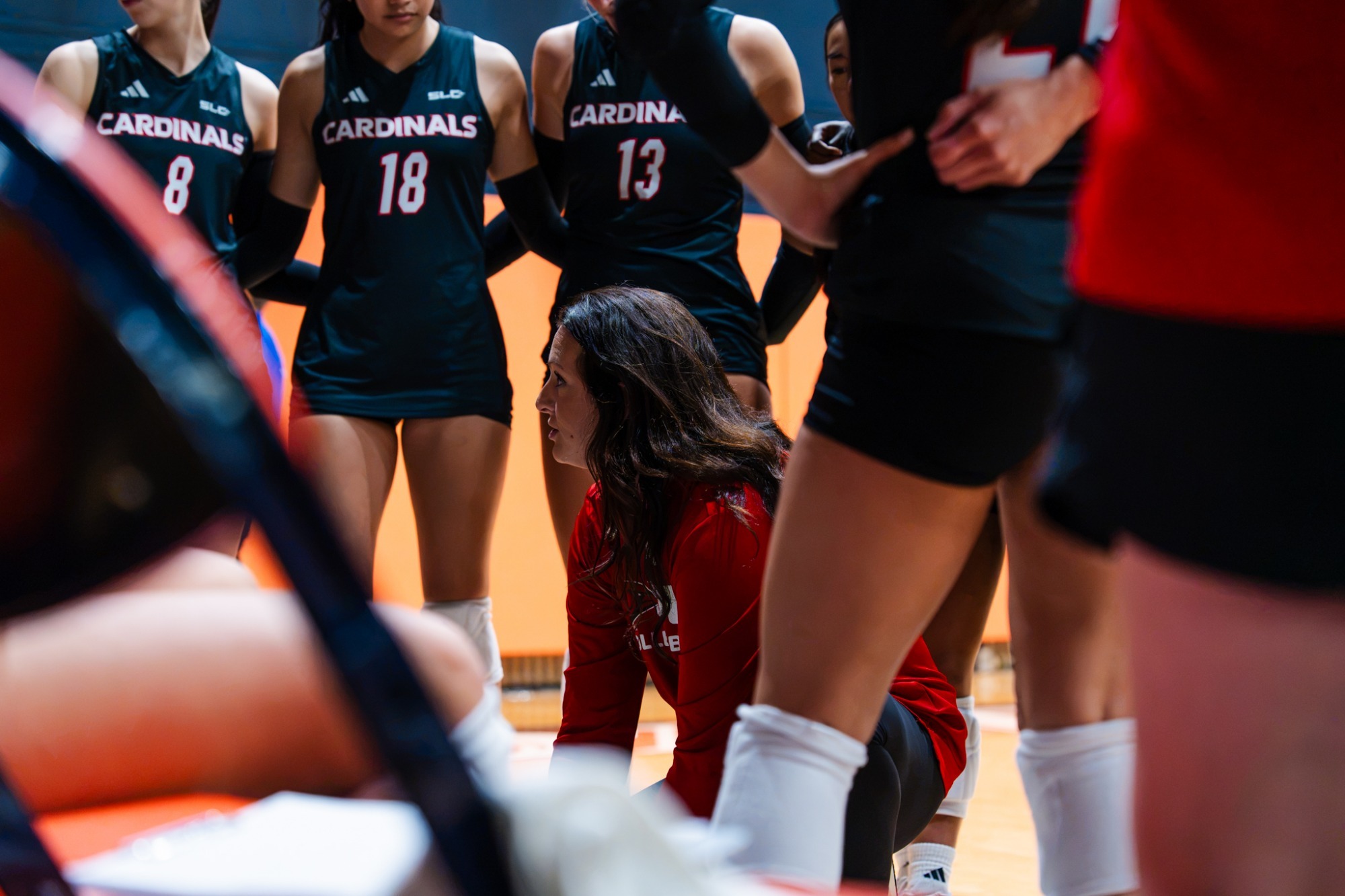 Head Coach Gabby Ording huddle with her players