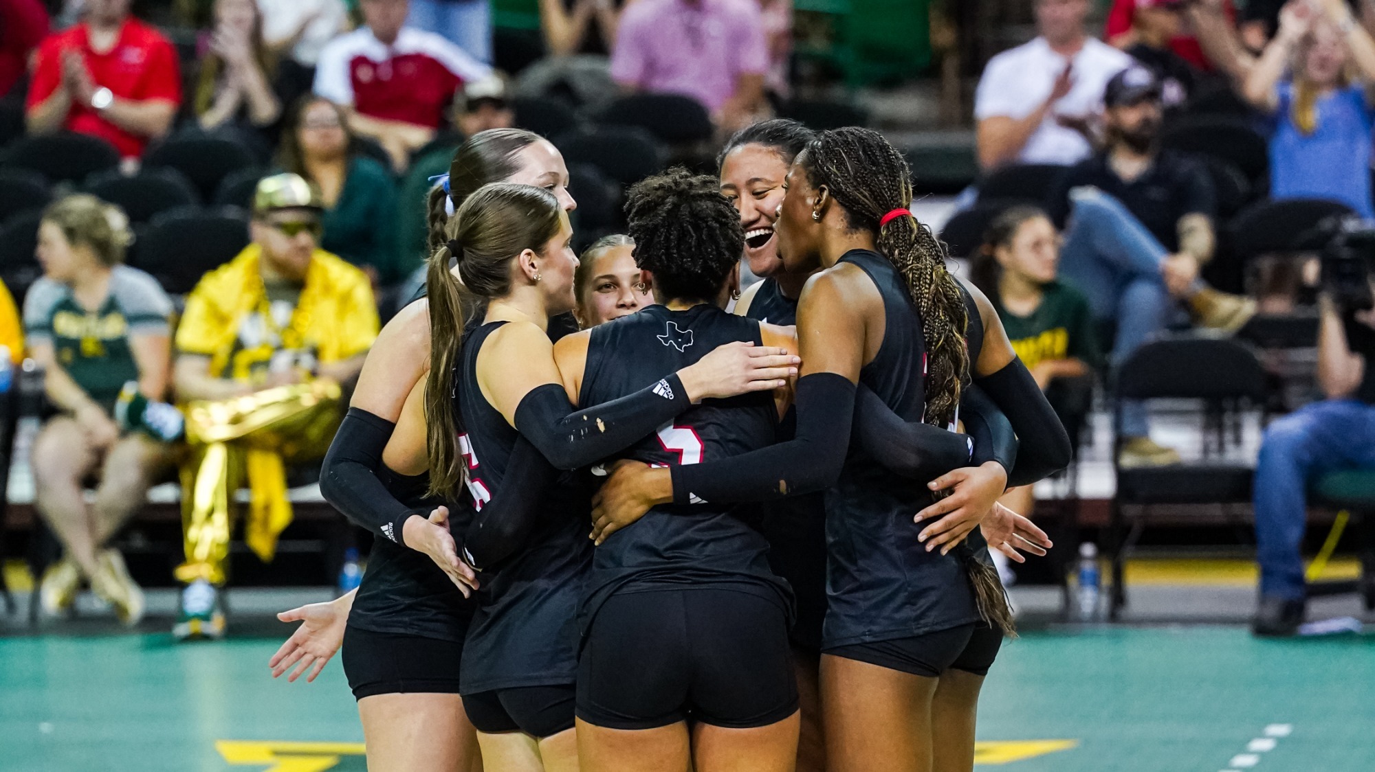 Volleyball huddles at Baylor