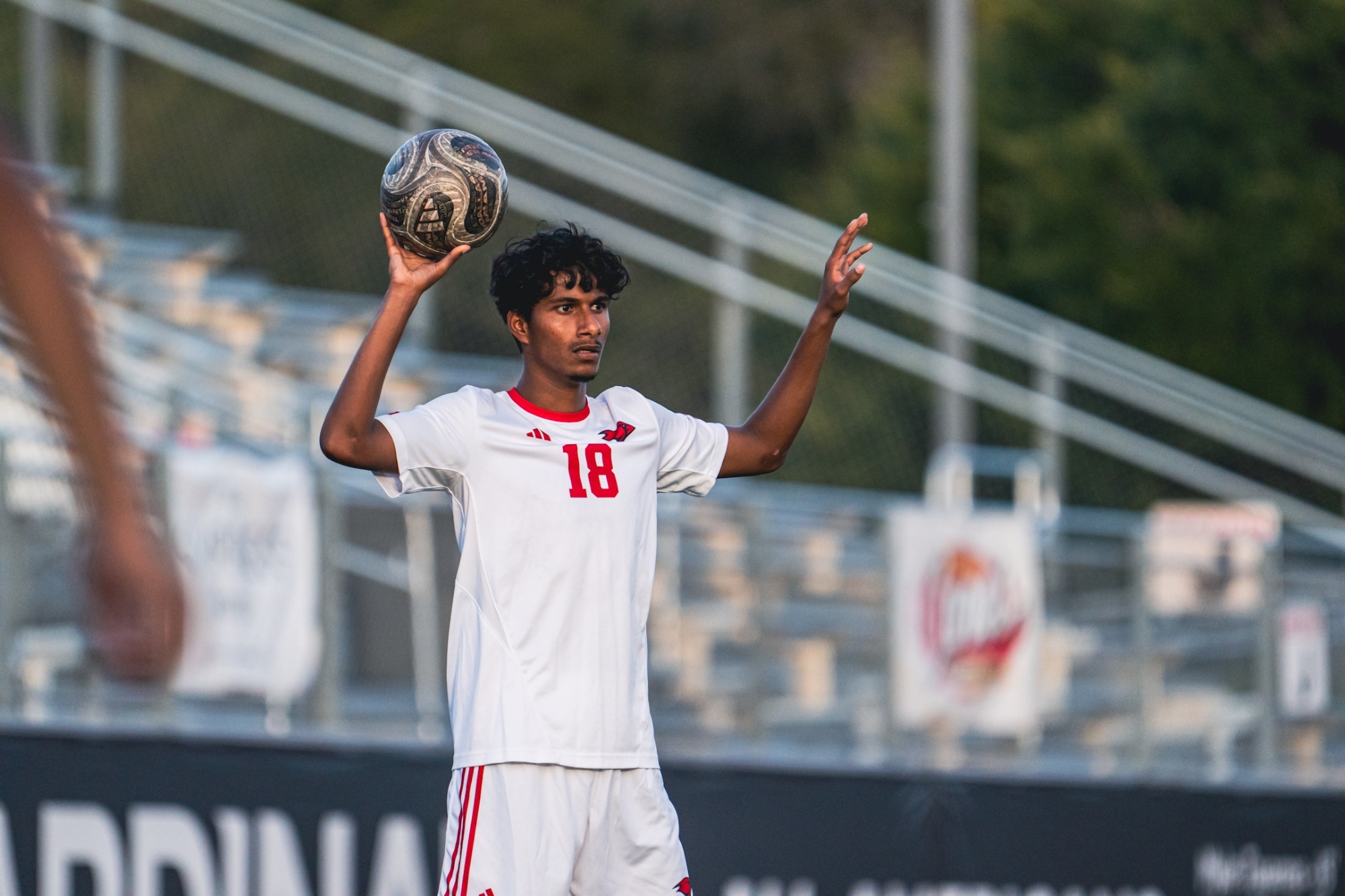 Men's soccer throws in ball