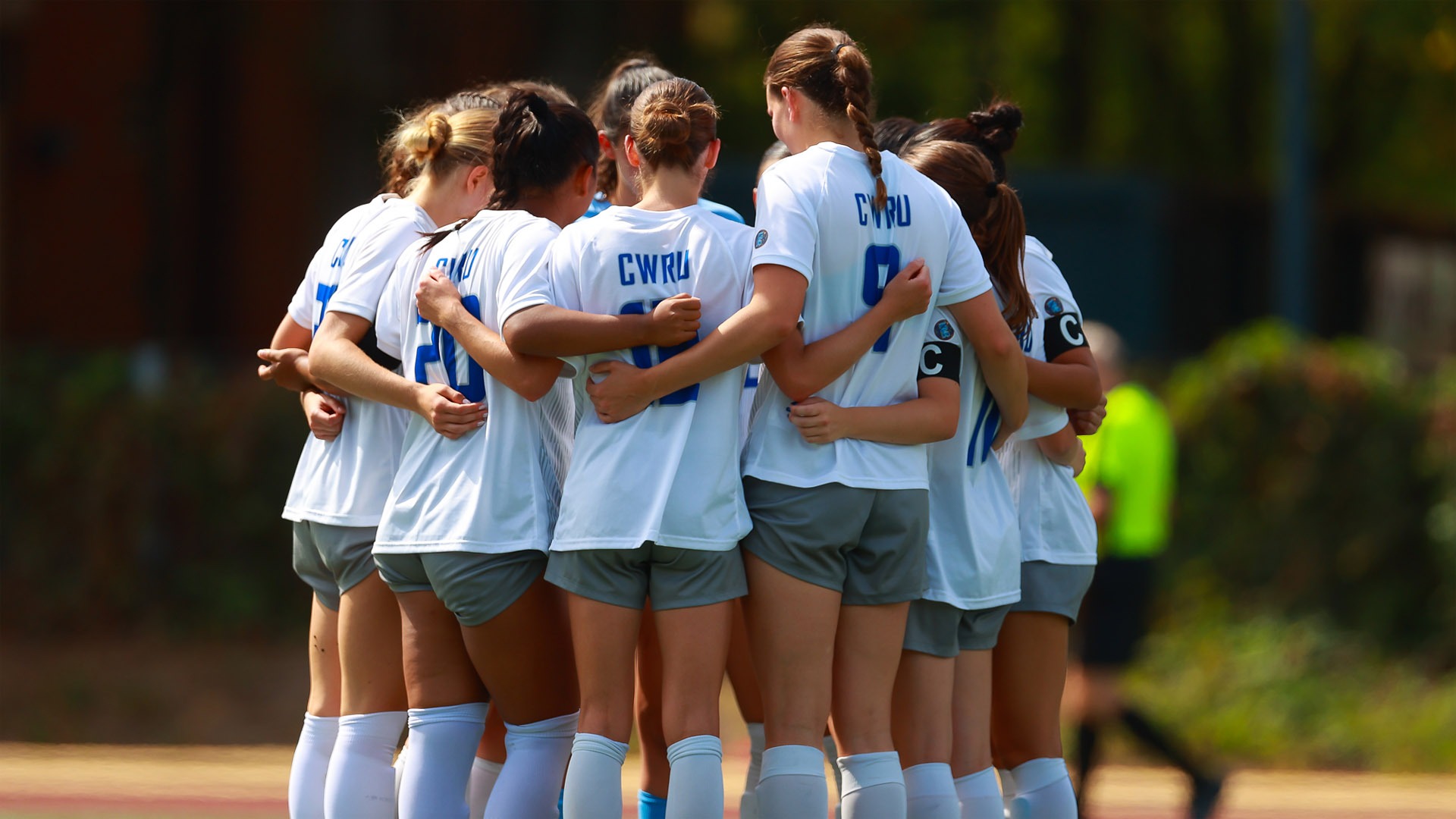 CWRU Women's Soccer in a huddle against Calvin