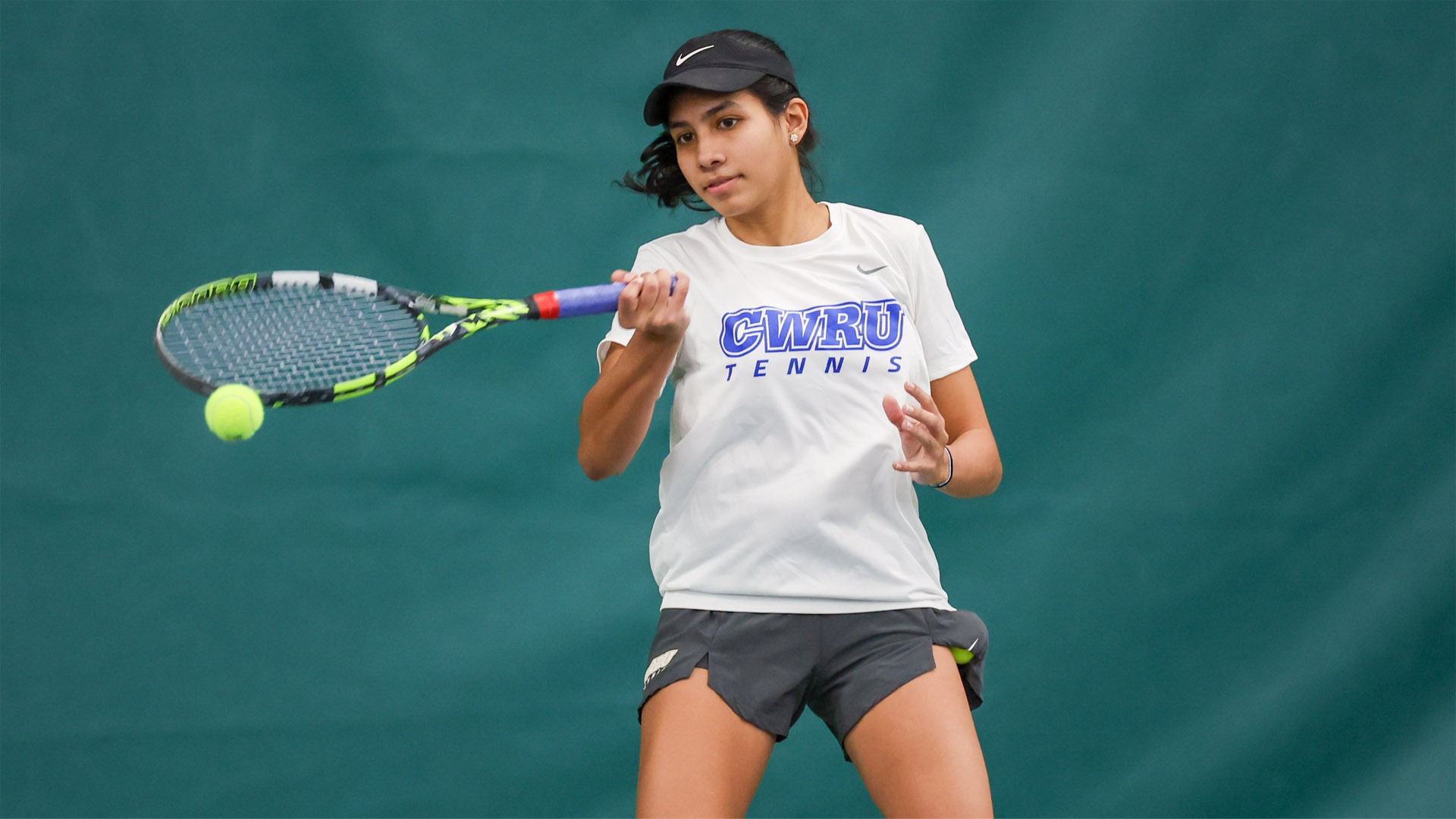 Kareena Sivanesan hitting a forehanded shot in February 2025