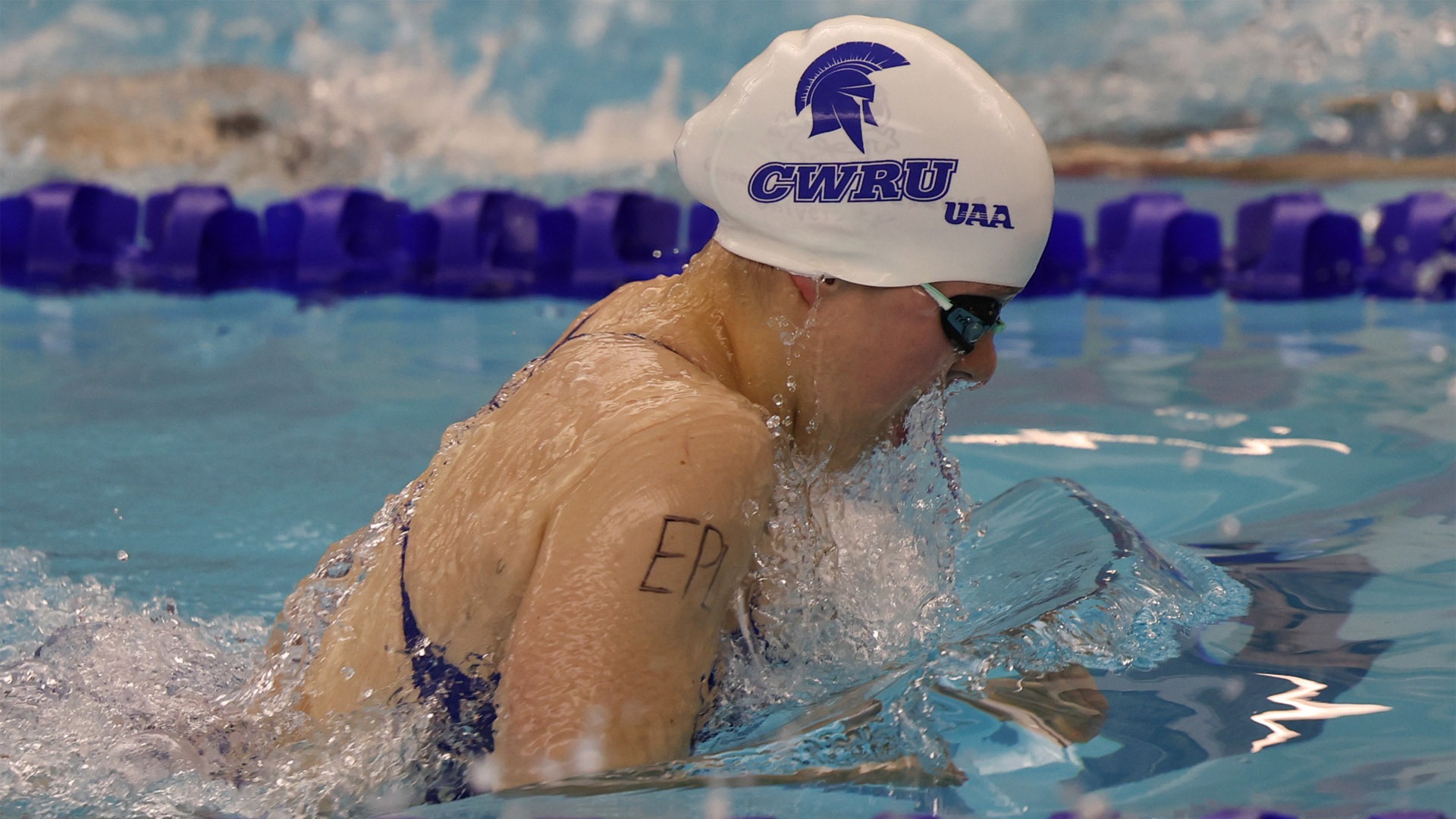 A Spartan swimmer with EPL written on their right shoulder during a race against CMU