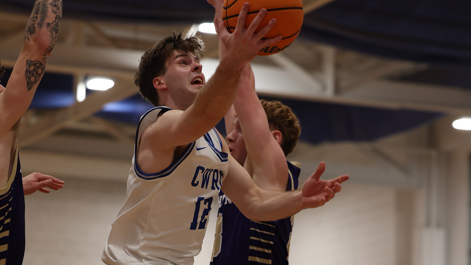Matthew Ellis attempting a layup against Houghton