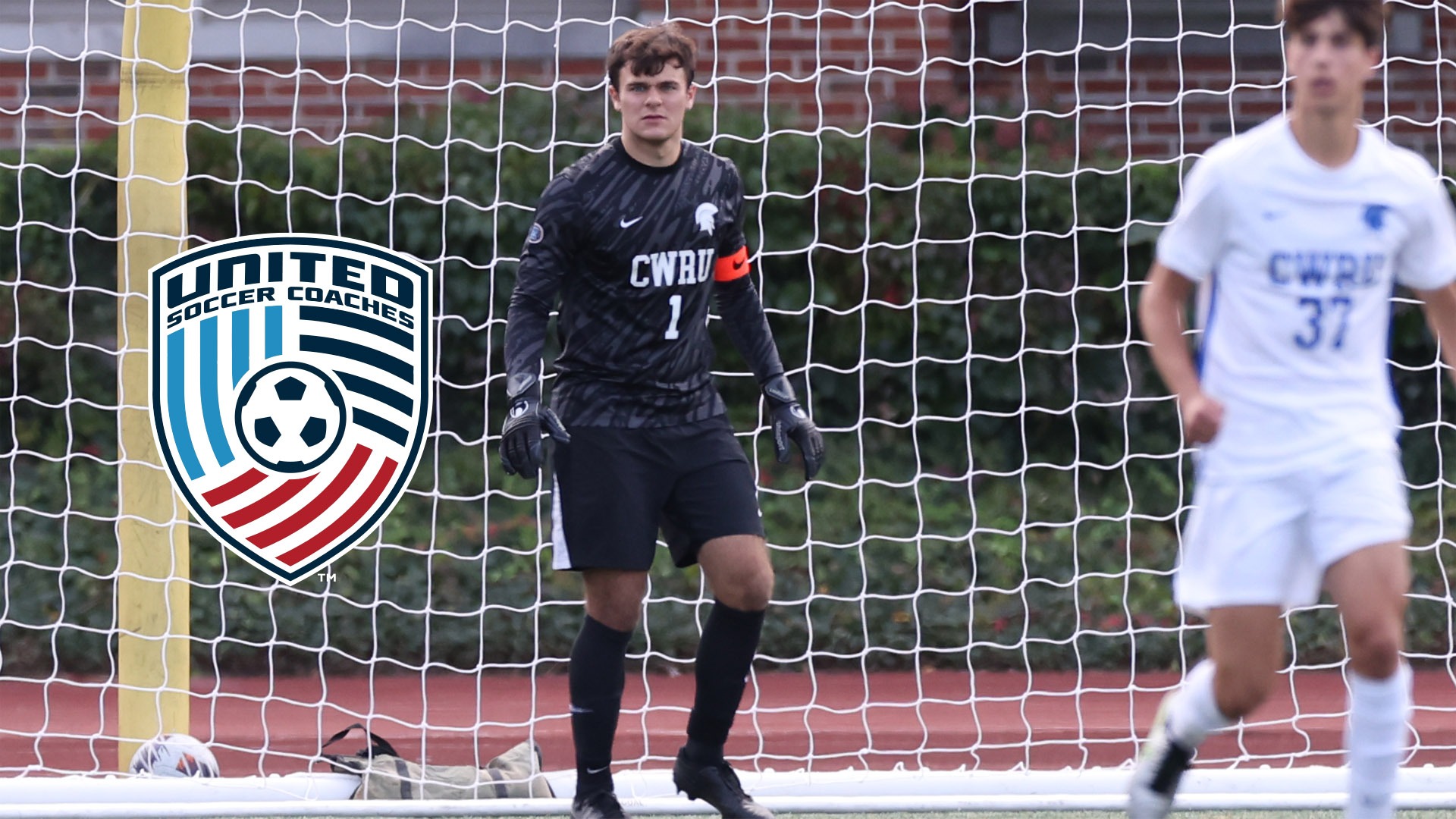 Bradley Winter standing in front of the goal with the United Soccer Coaches logo on the left