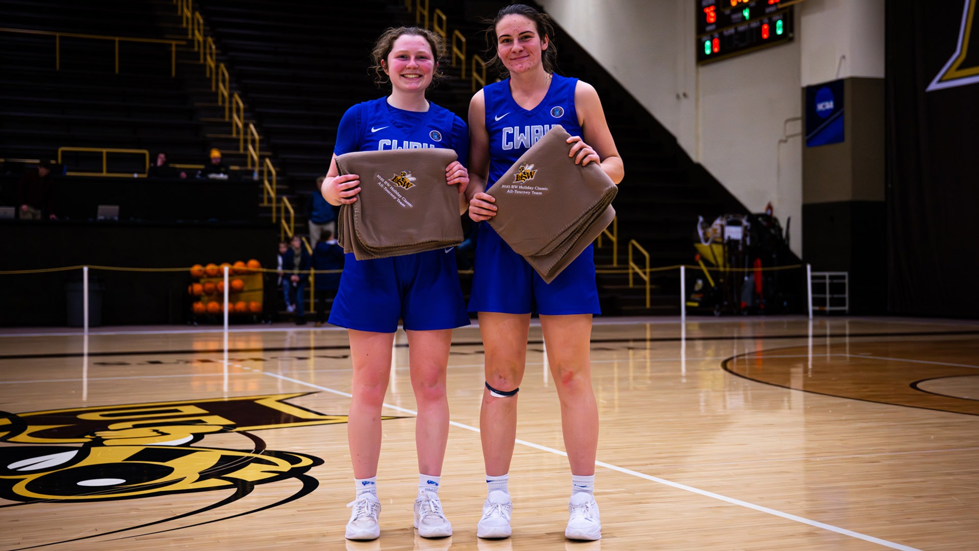 Mya Hartjes and Emily Plachta posing with their BW Holiday Classic All-Tournament awards