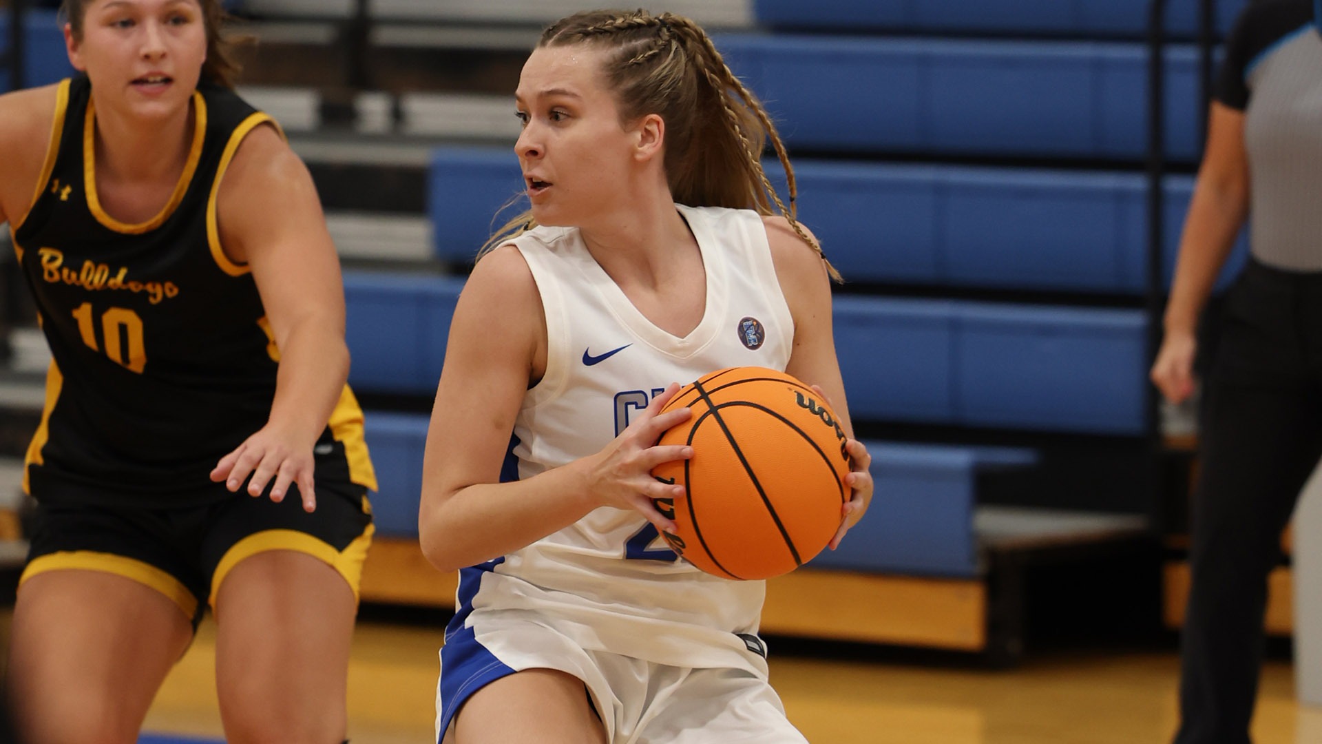 Jordyn Call holding the basketball against Adrian
