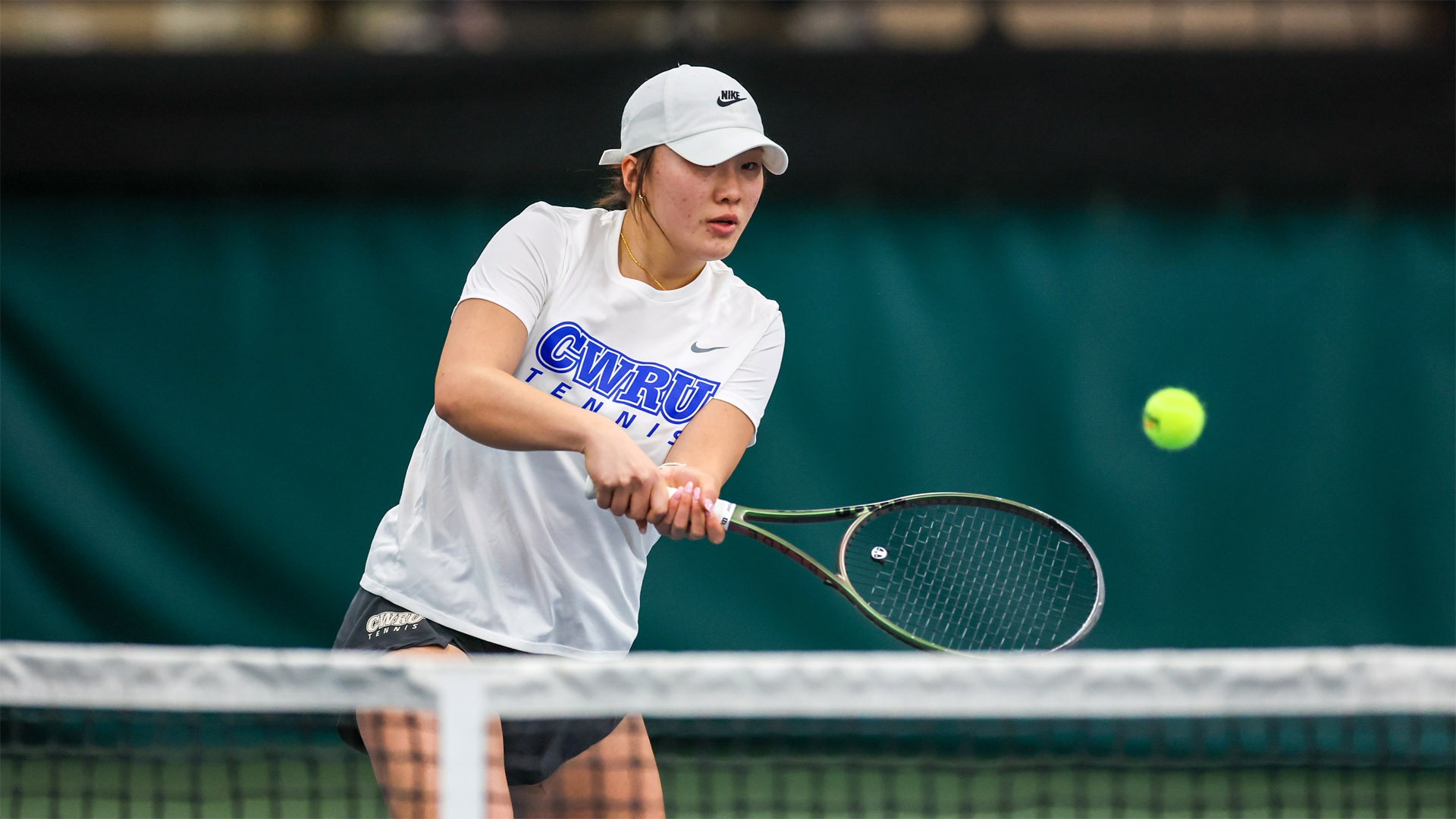 Katalina Wang attempting a drop shot during the 2024-25 season