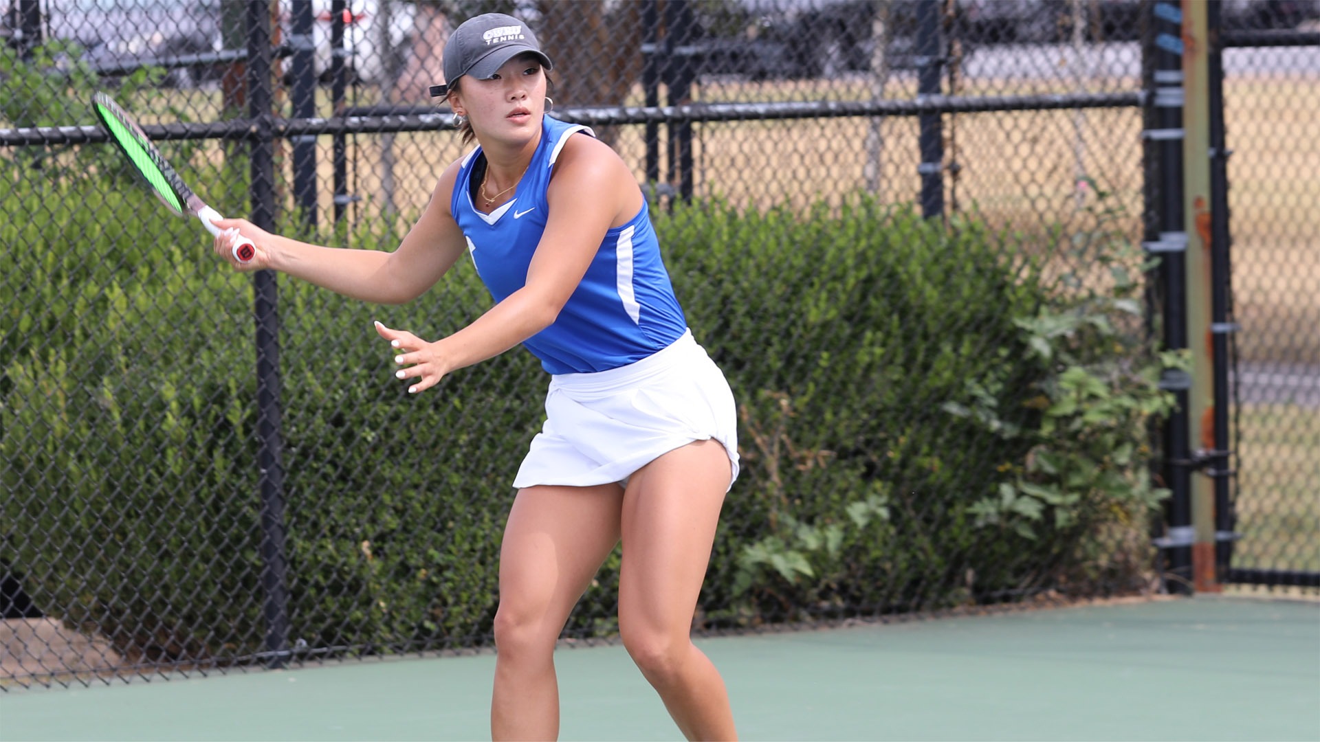 Katalina Wang about to hit a forehand shot at the ITA Regional in 2025