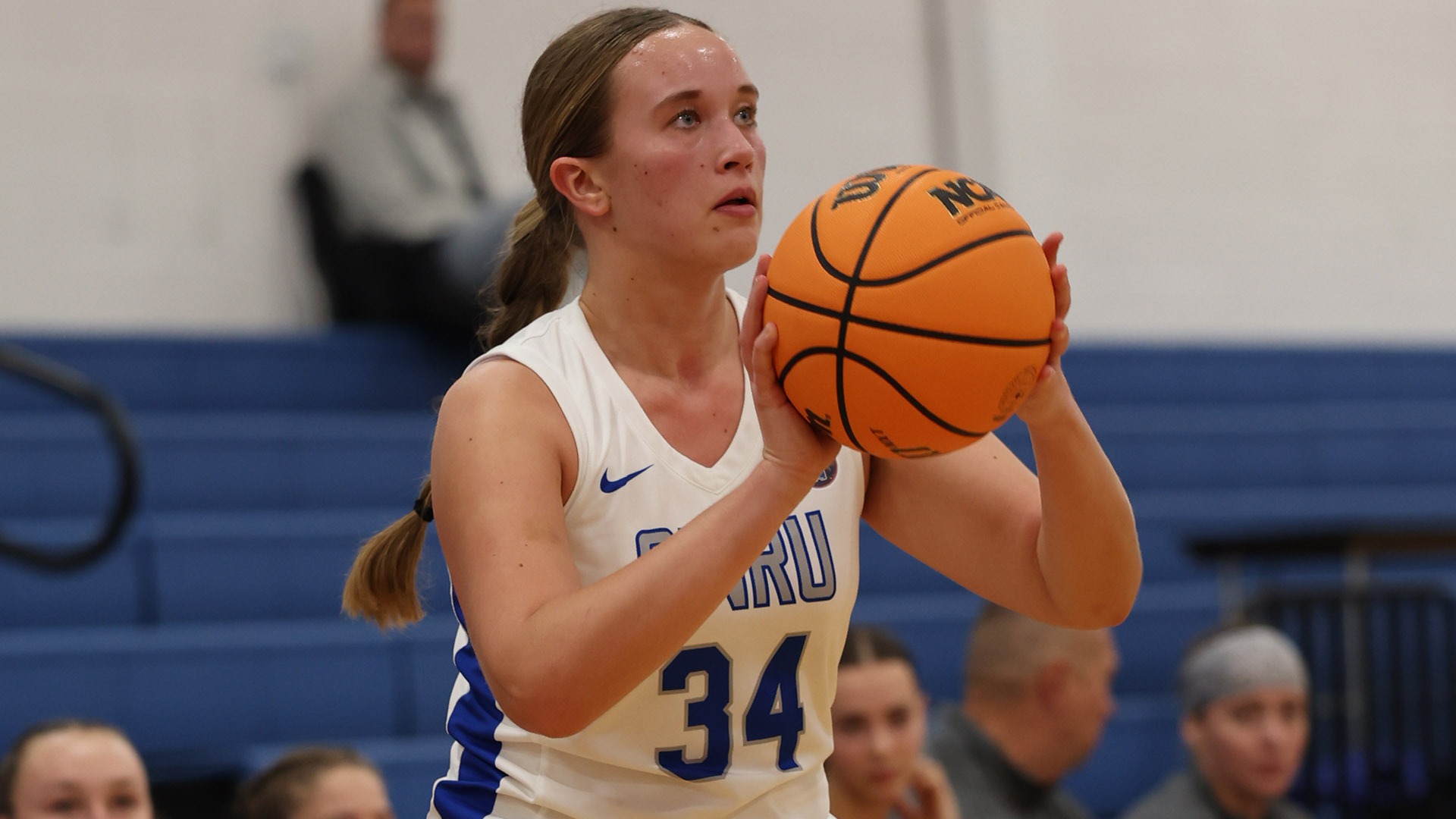 Taylor Angielski shooting a three-point shot