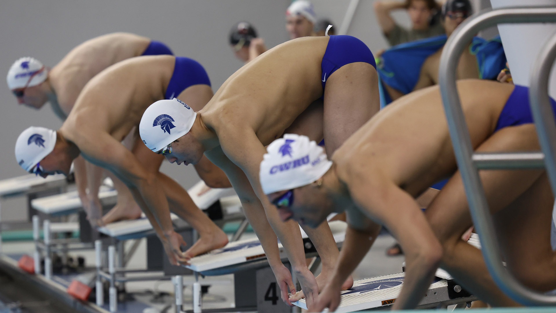 CWRU men's swimmers on the starting block