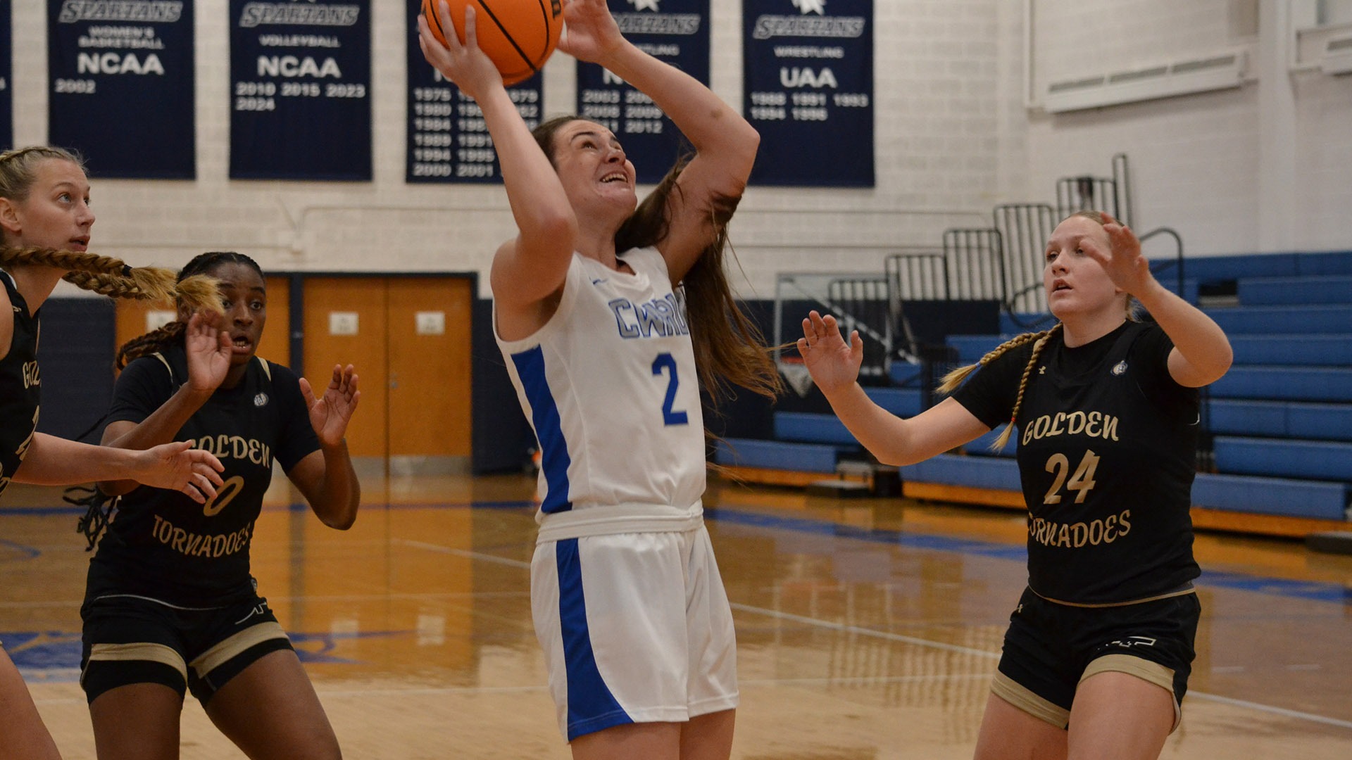 Emily Plachta makes a basket against Geneva