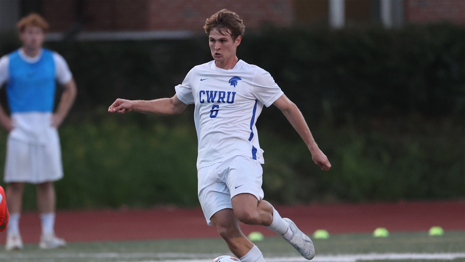 Owen Guffey about to kick the soccer ball vs. OWU