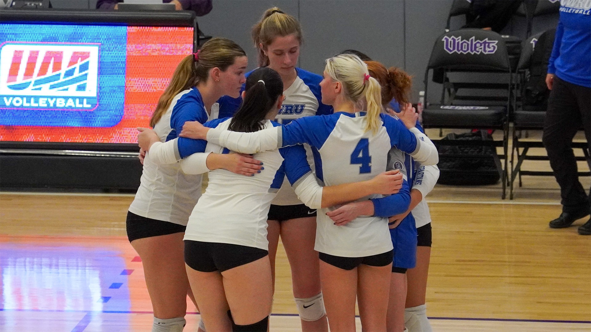 The Spartan volleyball team in a huddle at the second UAA Round Robin in 2026
