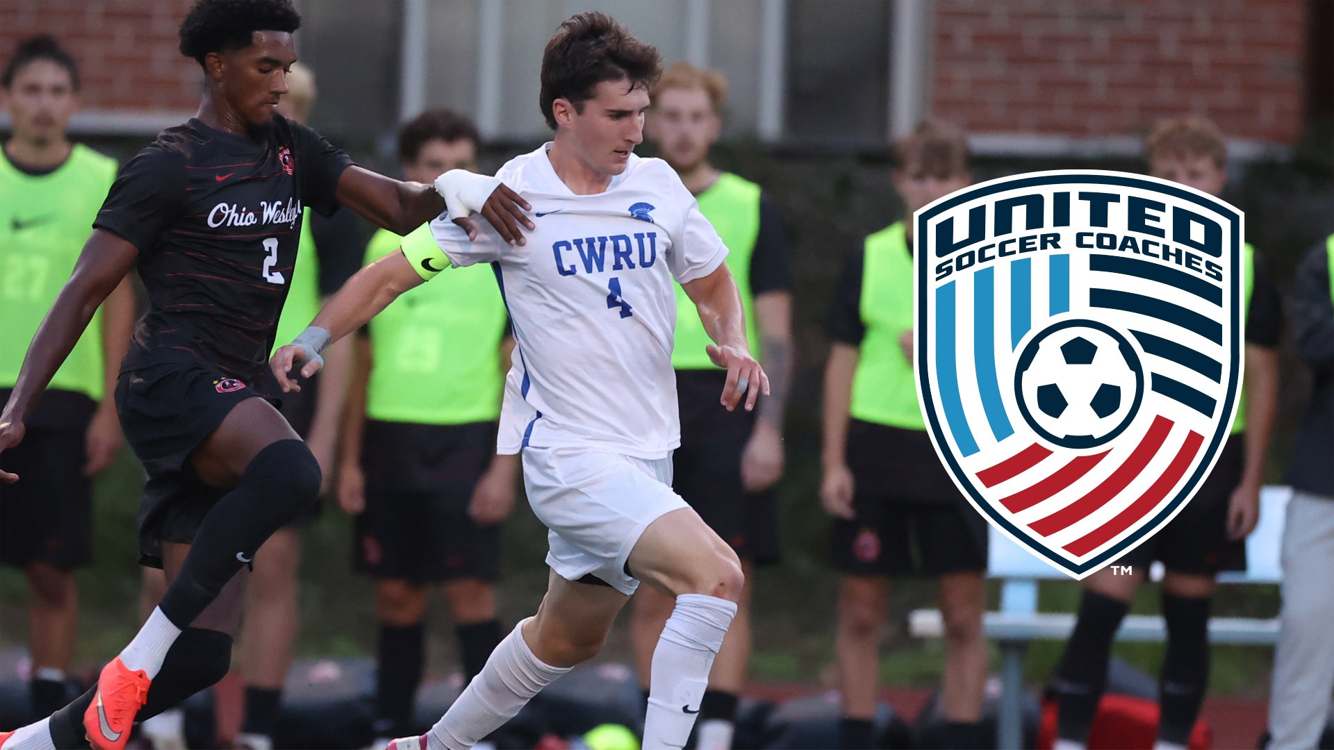 Cormac Apostolides on the ball with the United Soccer Coaches shield logo on the right