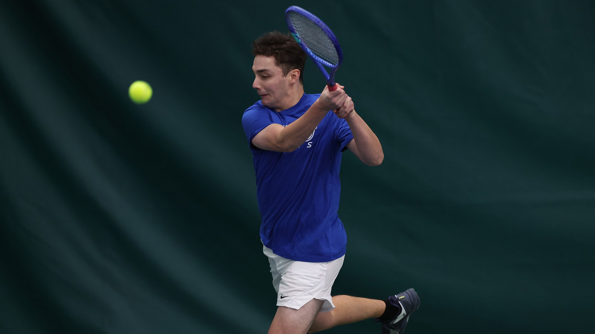 Rowan Matorin hits a forehand shot against Rochester