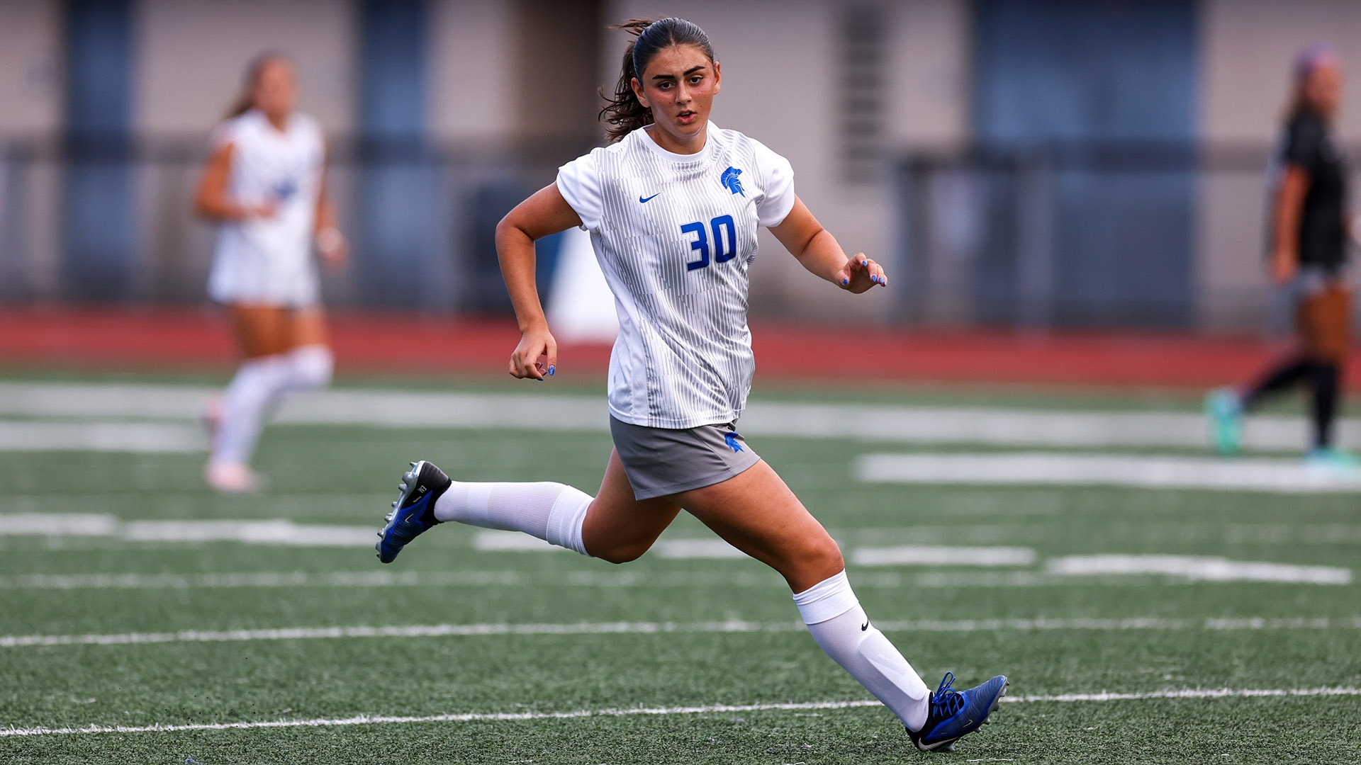 Emily Callanen running for the ball against Capital