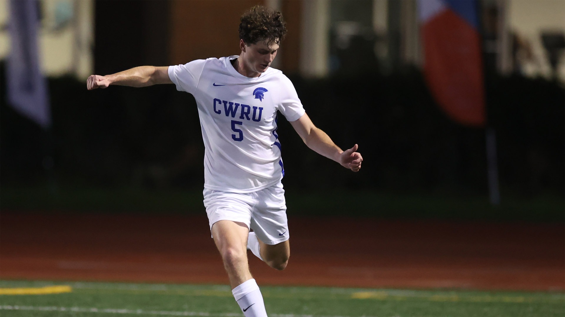 Cameron Thayer about to kick a soccer ball