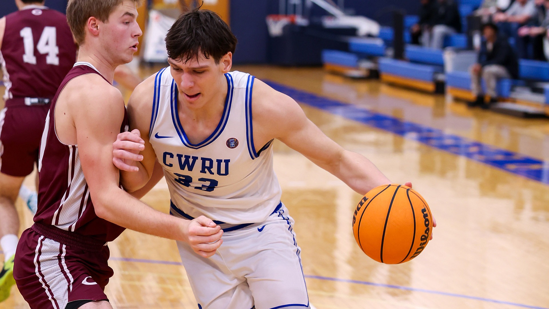 Alex Vincent drives to the hoop against a Chicago player