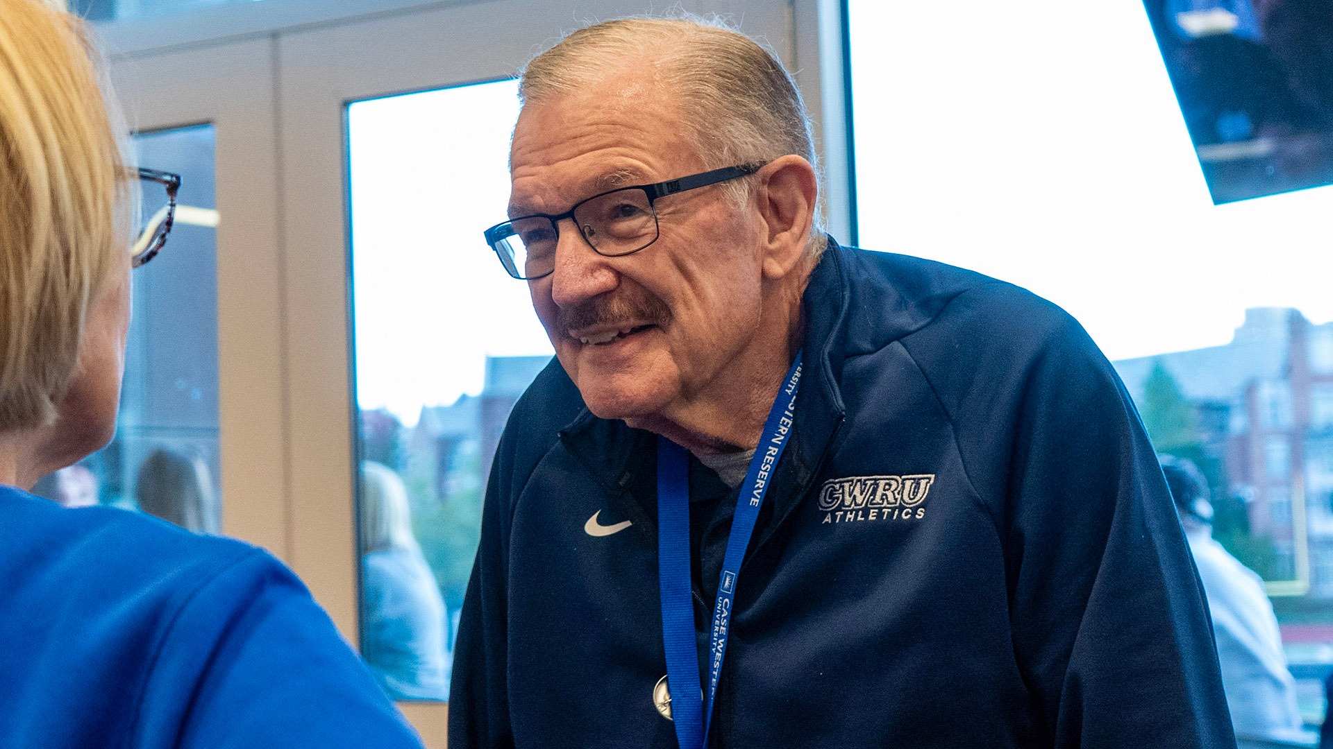 Jim Treleaven speaking to someone during a CWRU event