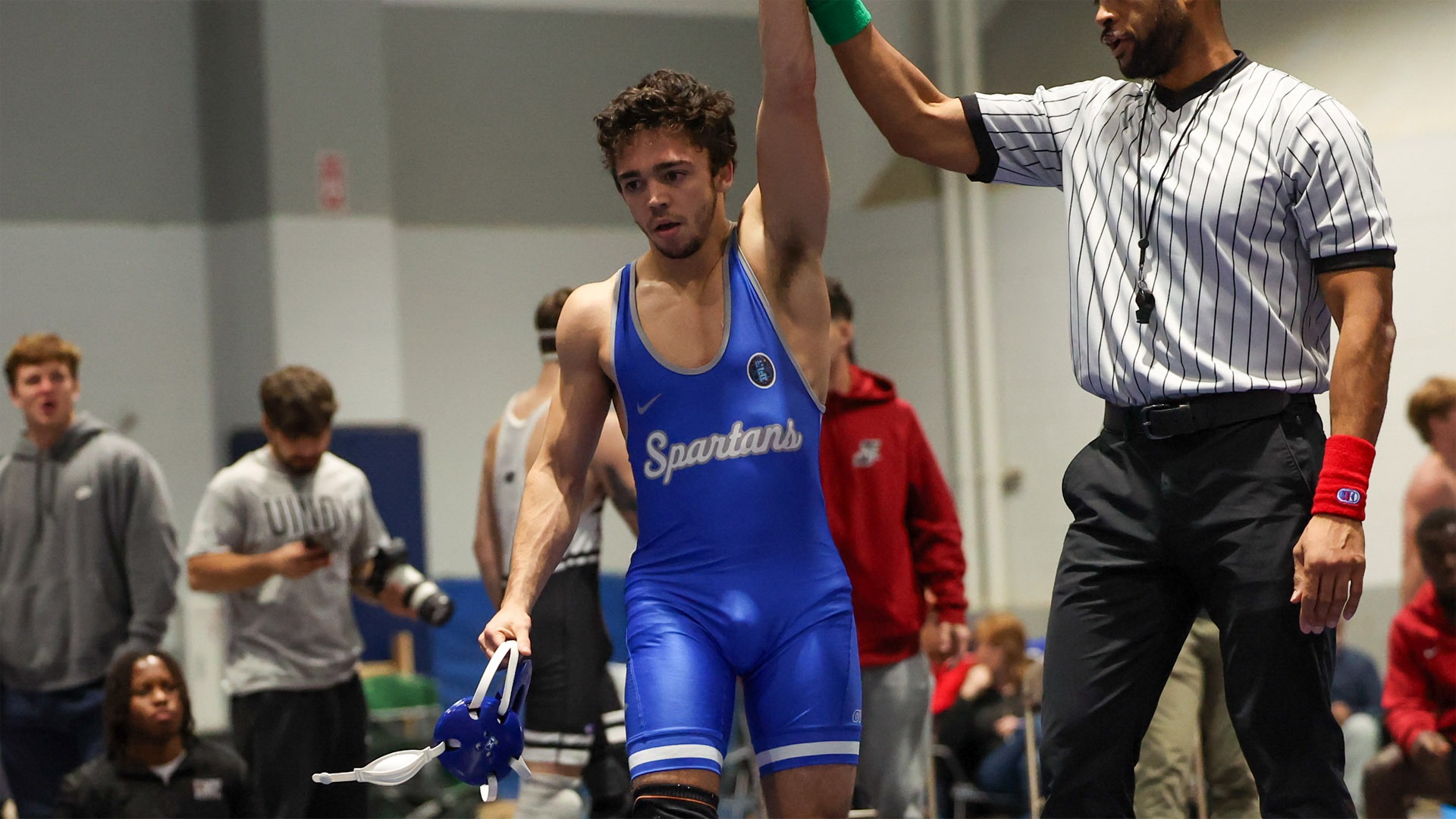 Alexander Greene Barrios with his hand raised after a win