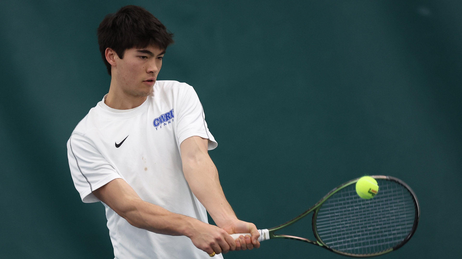 Derek Shiffer hitting a tennis ball