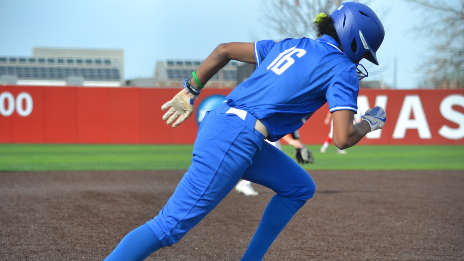 Nylah Durham running to first base against WashU in 2025