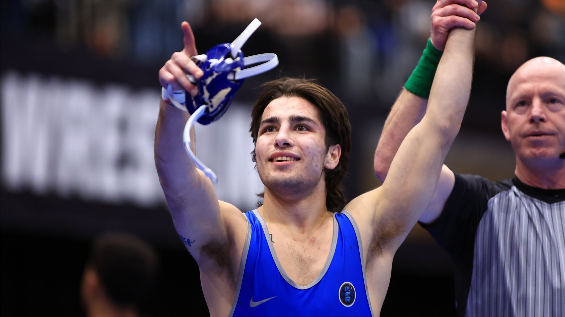 Art Martinez pointing to the crowd after winning and securing All-America honors