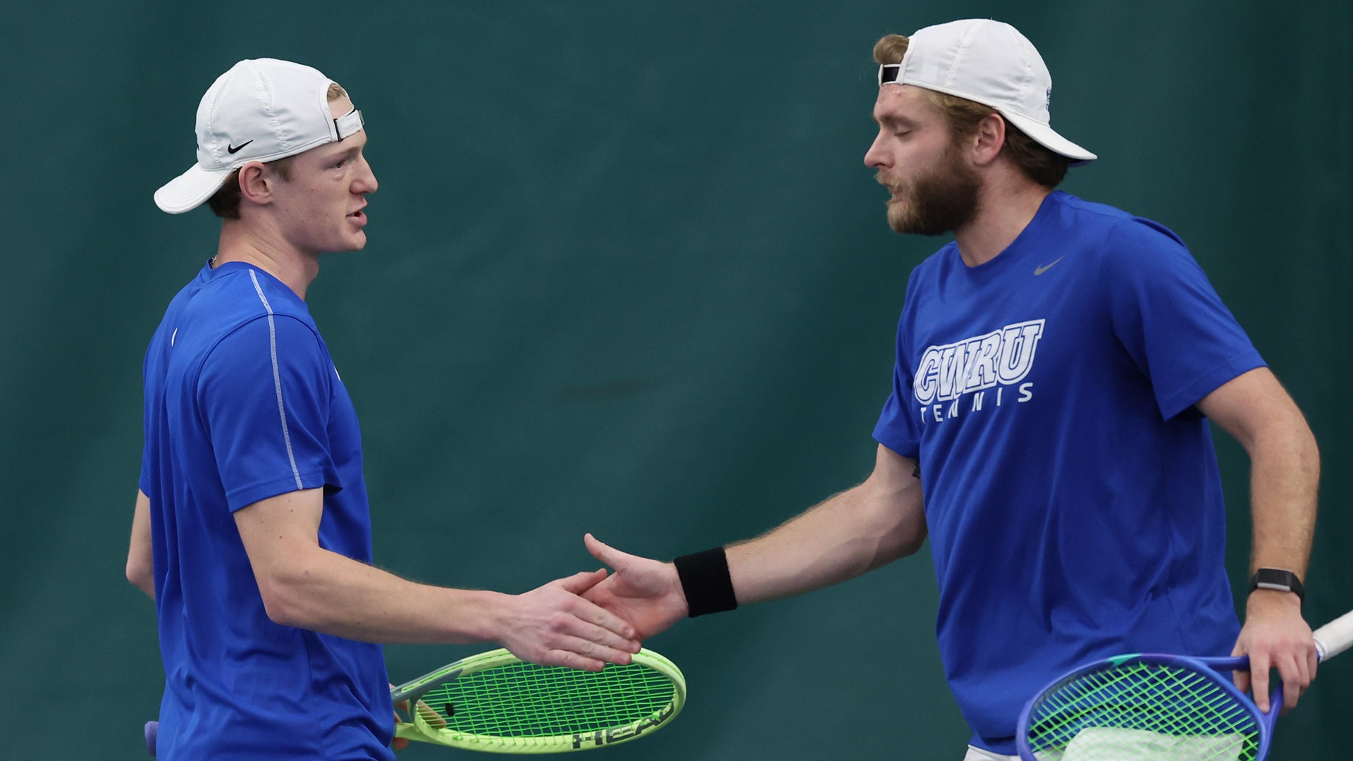 Trey Lambright (left) and Bryce Ware (right) high fiving after a point