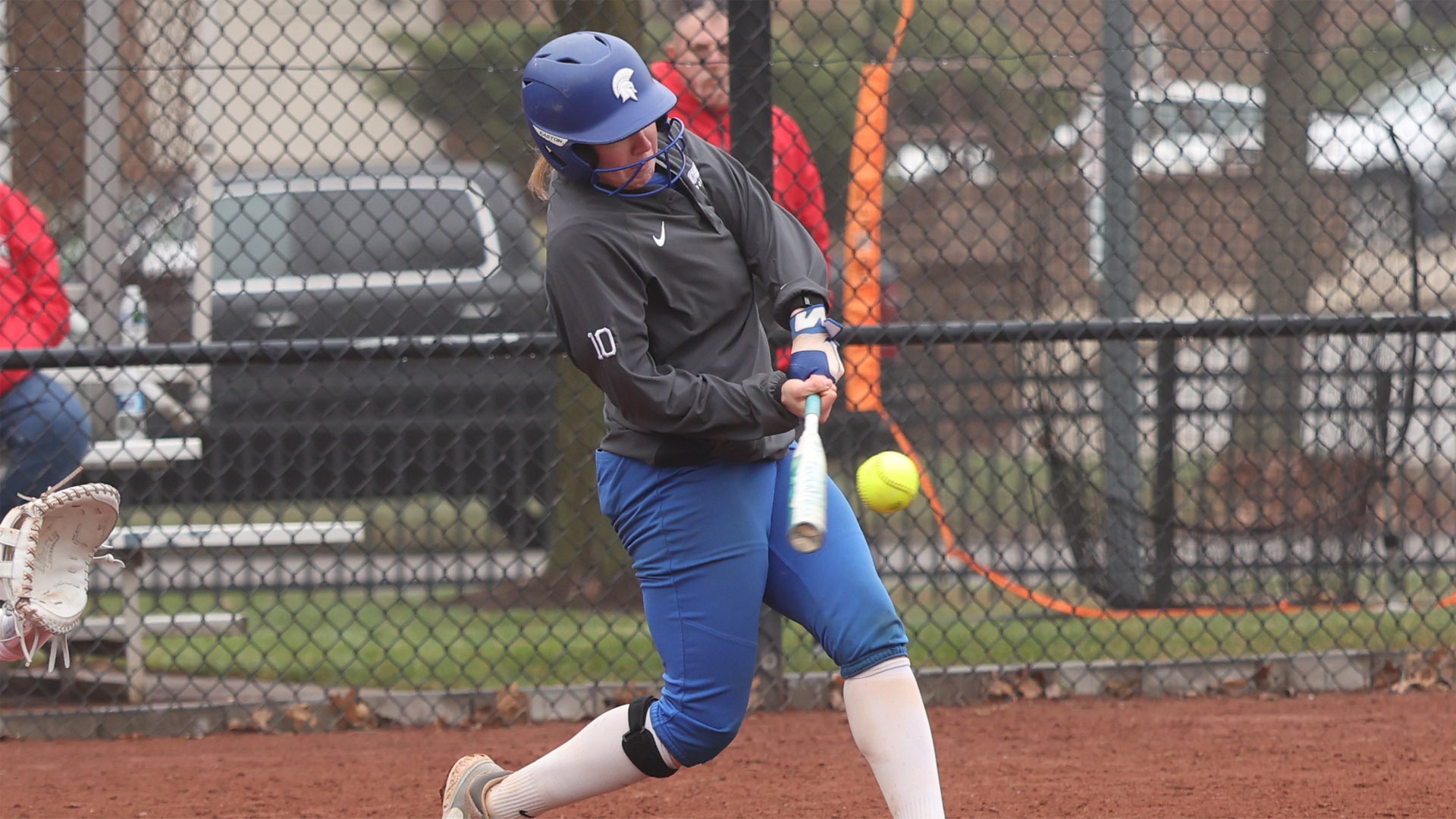 Sophia Becker about to make contact during a swing against WashU