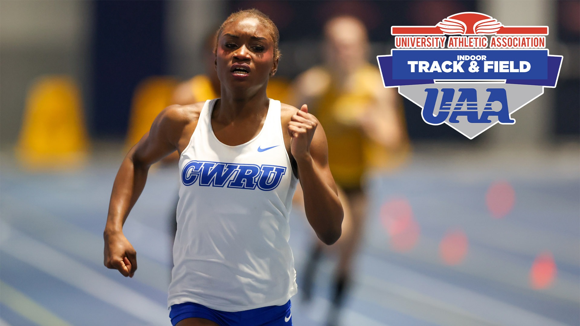 Gianna Phipps running with the UAA Indoor Track and Field logo in the top right