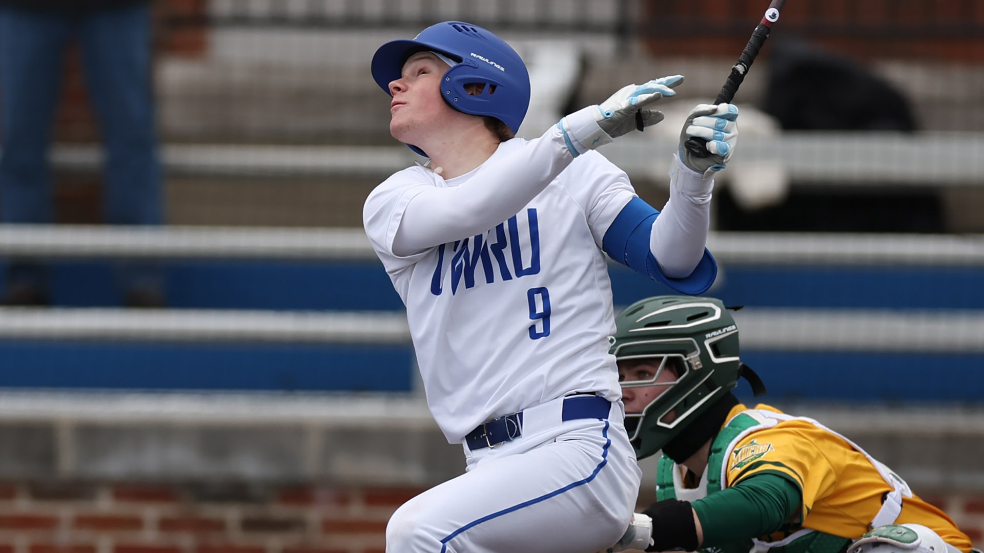 Collin Pool hitting a ball against Oswego State