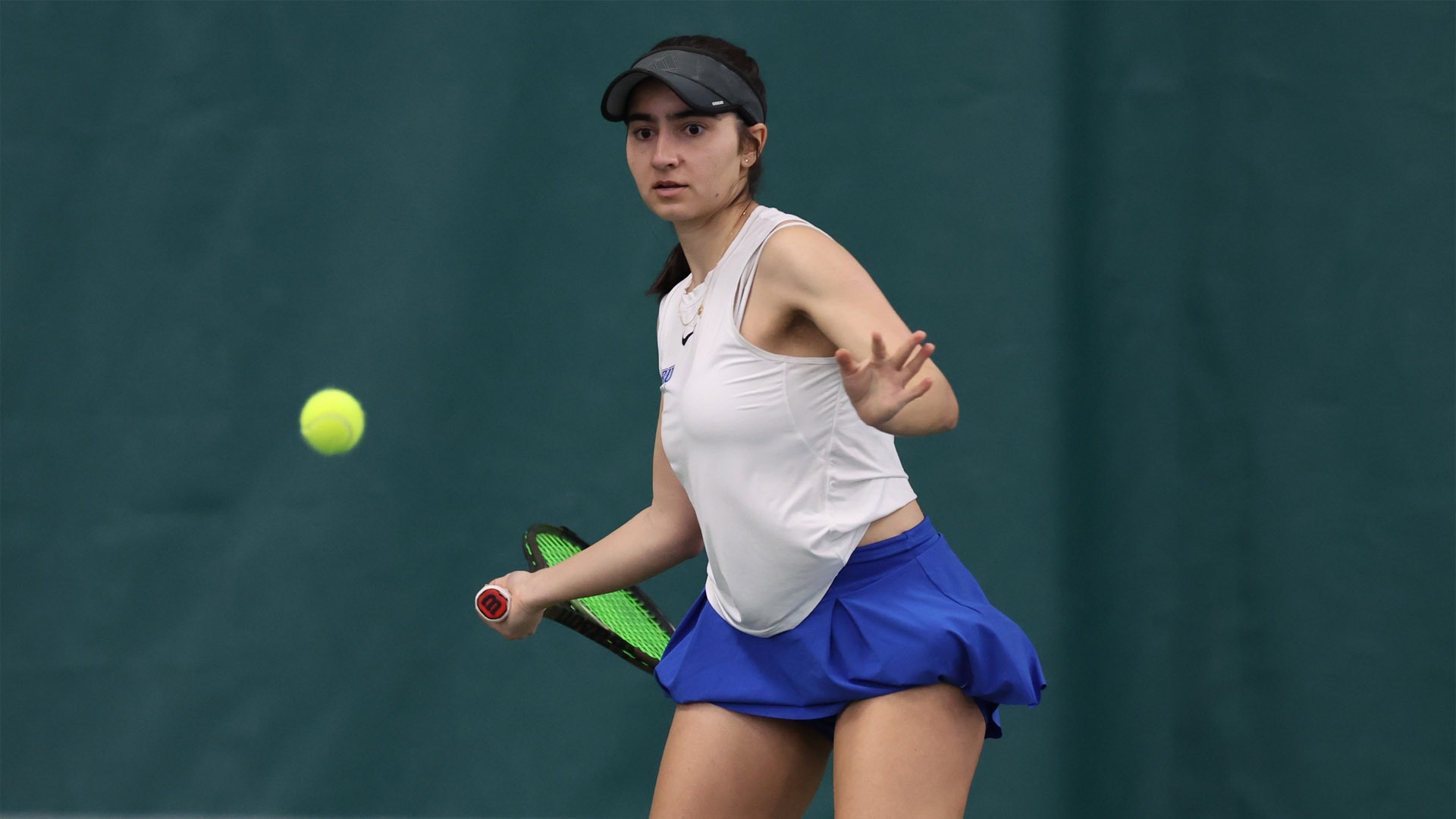 Atra Biria about to hit a forehanded shot