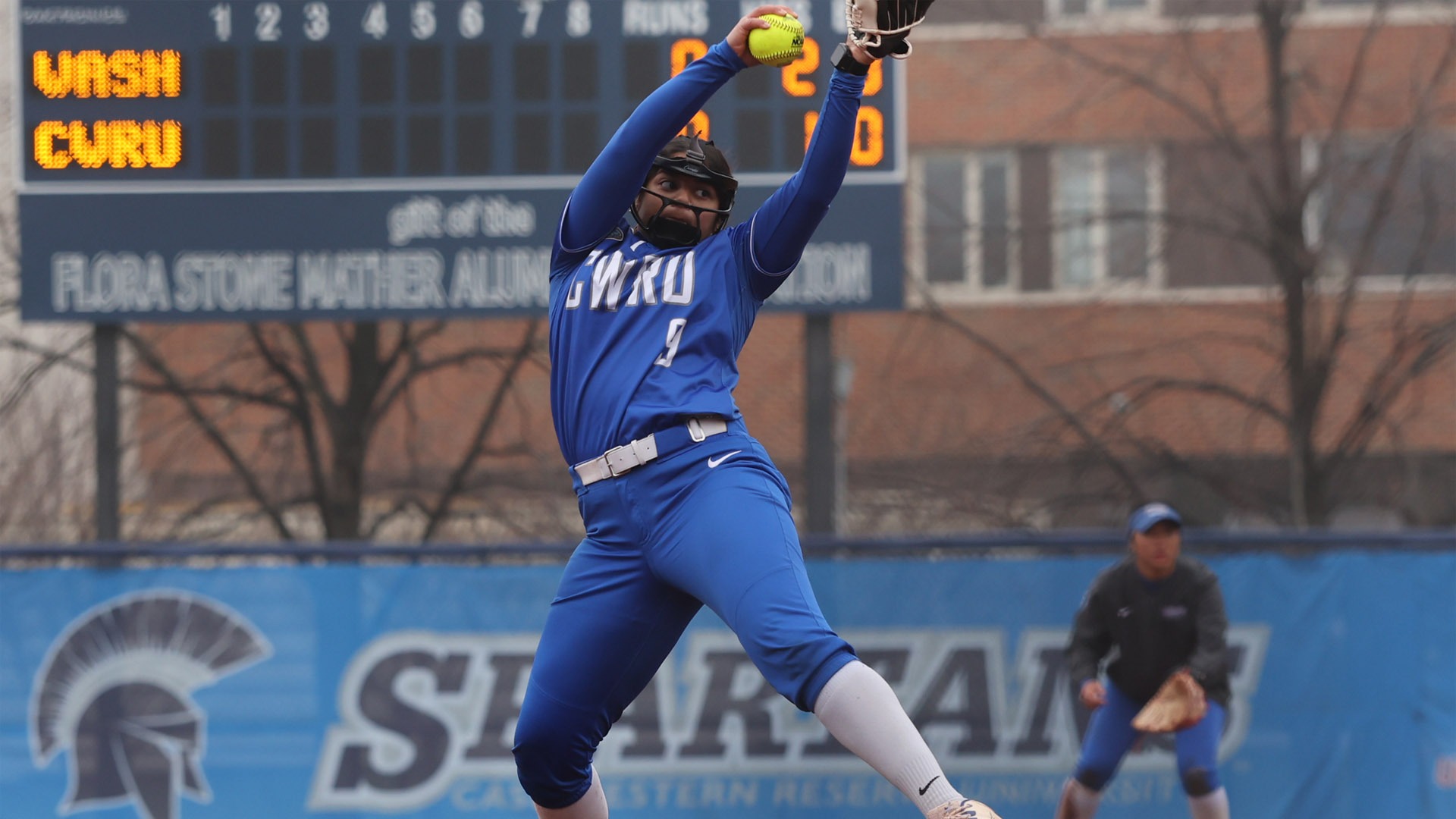 Devanghi Misra throwing a pitch against WashU