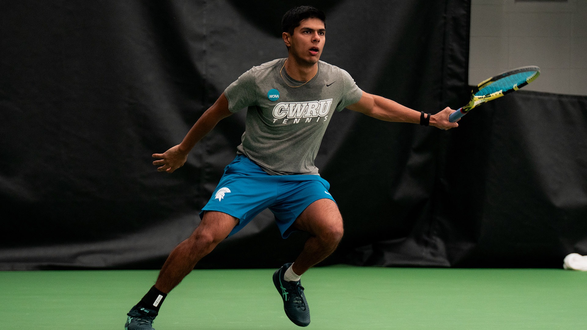 Ansh Shah getting ready to return a shot