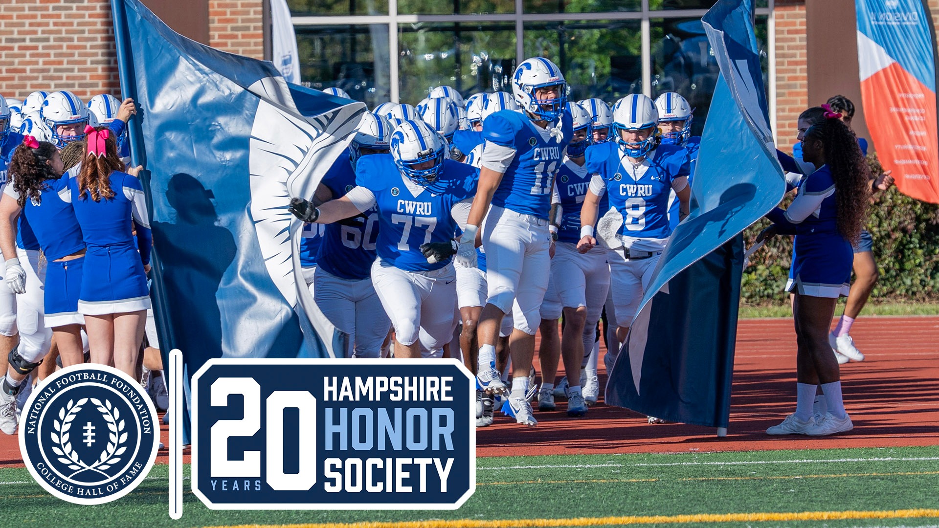 CWRU football players entering the field through a banner; The NFF 20-year logo
