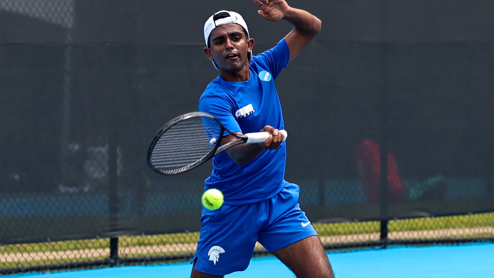 Anmay Devaraj hits a forehand during the NCAA semifinal match against Denison